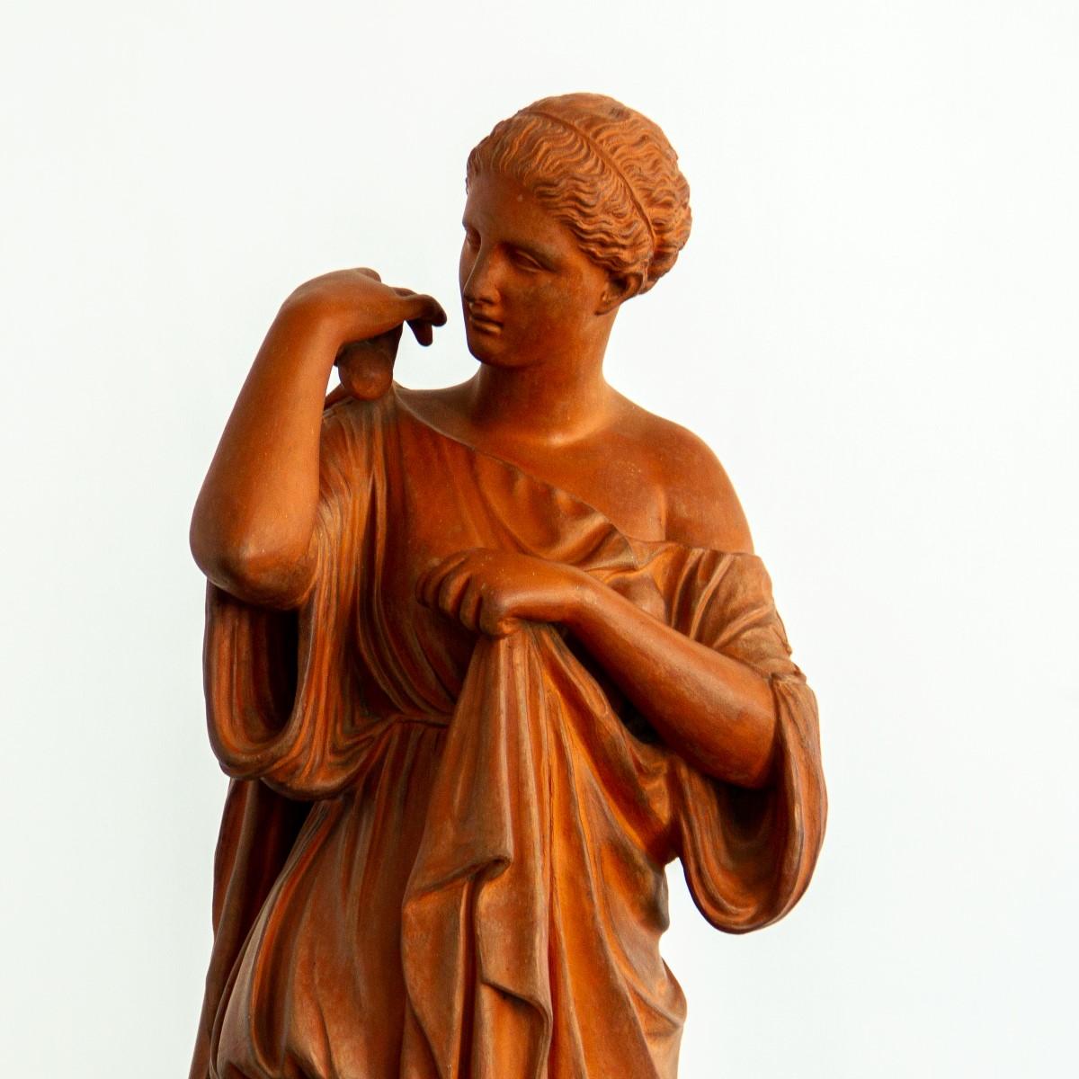 After the Antique a 19th century terracotta figure of Diana de Gabies. Stamped J.M Blashfield. 

John Marriott Blashfield (1811-1882) was a mosaic floor and terracotta manufacturer in the 19th century. His early career saw him working for cement
