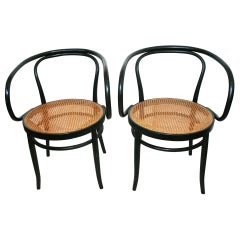 D'après Thonet 209:: paire de chaises en bois de roseau et de bois noir:: années 1950