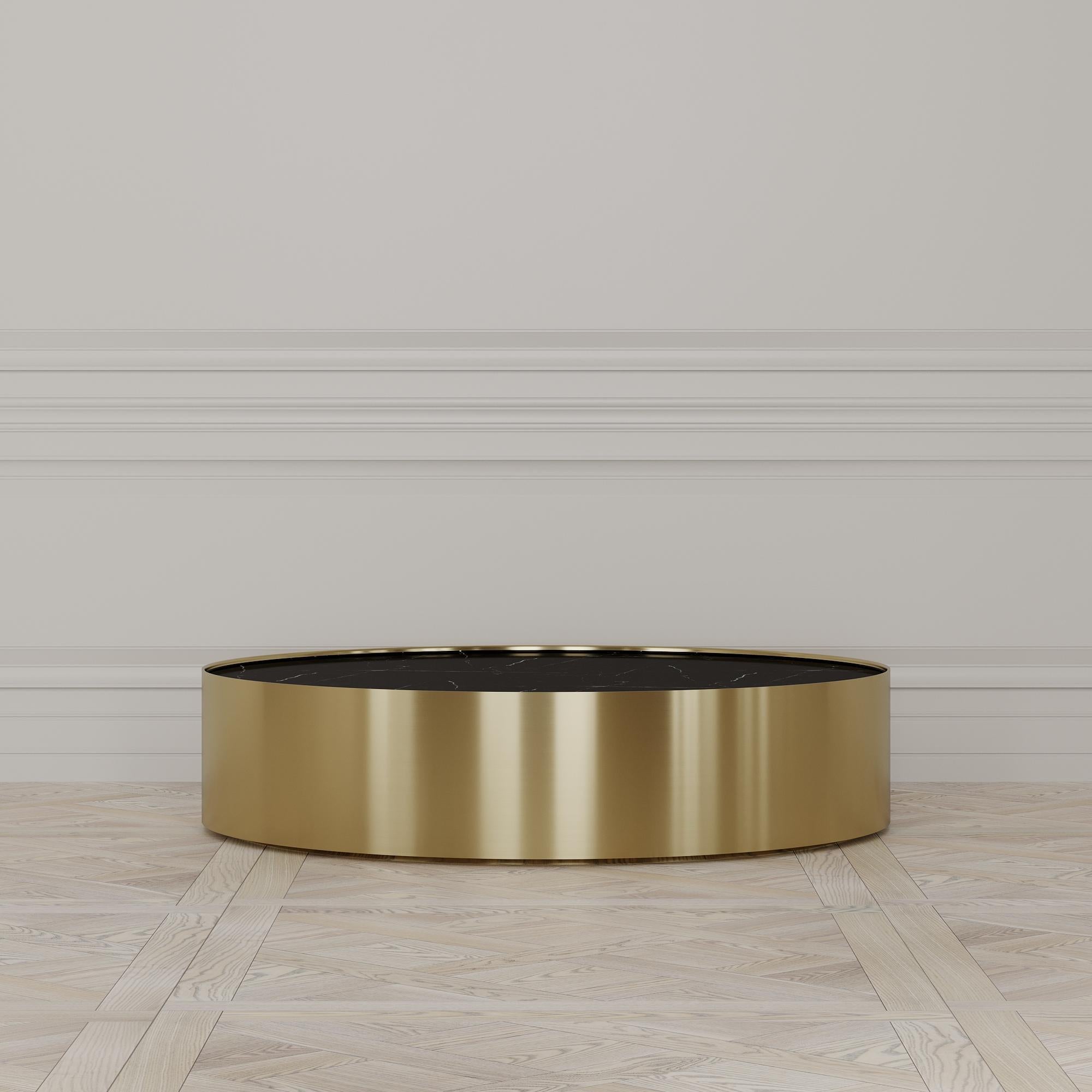 The Afterglow coffee table is designed by Emél & Browne in the Minimalist and contemporary style and custom made in Italy by skilled artisans.

The Circular Nero Marquina Marble top evokes the certainty of the coming night, and acts as a back-drop