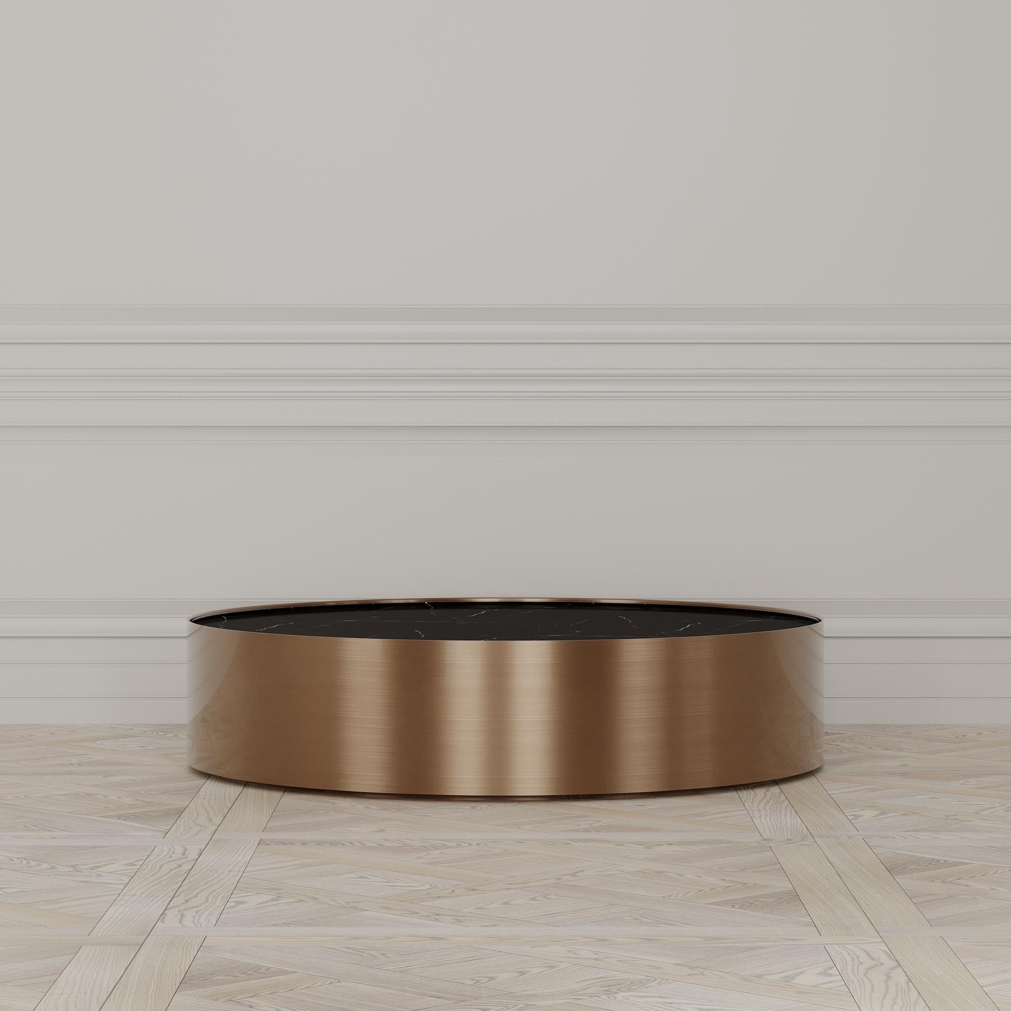 The Afterglow coffee table is designed by Emél & Browne in the minimalist and contemporary style and custom made in Italy by skilled artisans.

The Circular Nero Marquina marble top evokes the certainty of the coming night, and acts as a back-drop