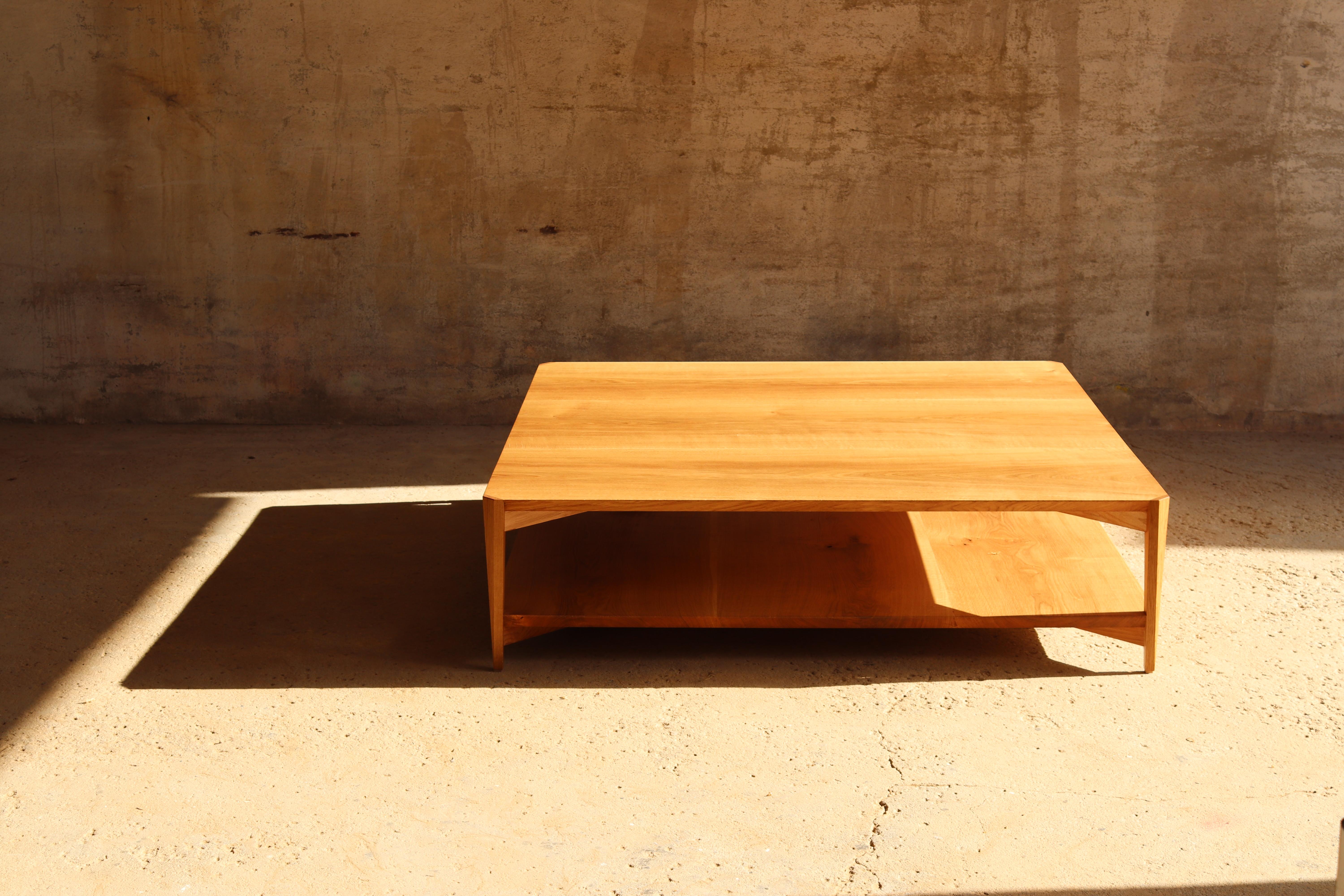 This carefully designed and handcrafted contemporary wooden coffee table by Tomaz Viana was first commissioned for a villa in Sublime Comporta on the Atlantic coast of Portugal.

It´s light and elegant thin legs support a chamfered top and