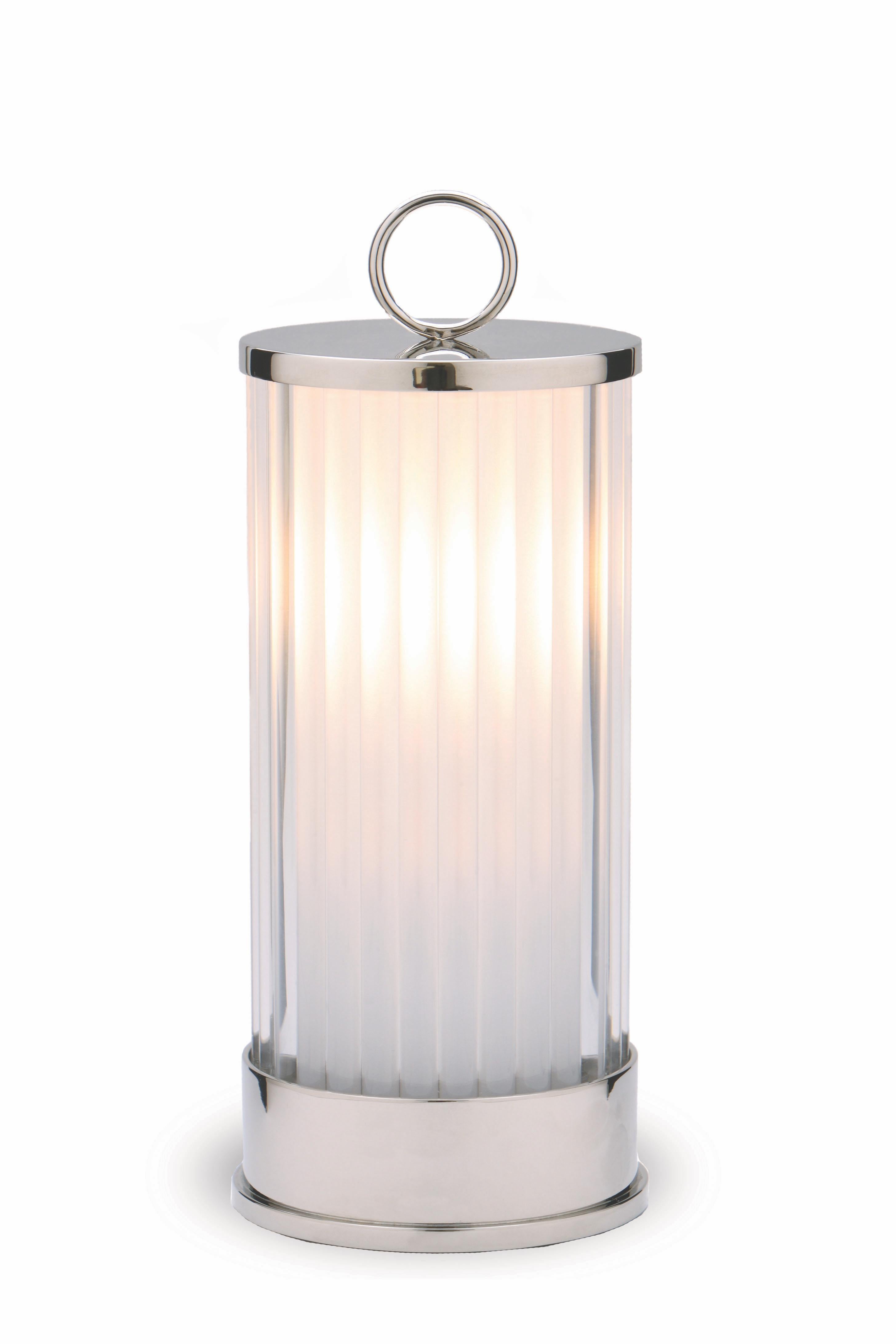 The Acorn lantern is made of silver-plated brass with an enclosed light source that provides a soft glow. 

The lantern is illuminated by LEDs and powered by 2 AA batteries (not included) allowing it to be easily used throughout a space.