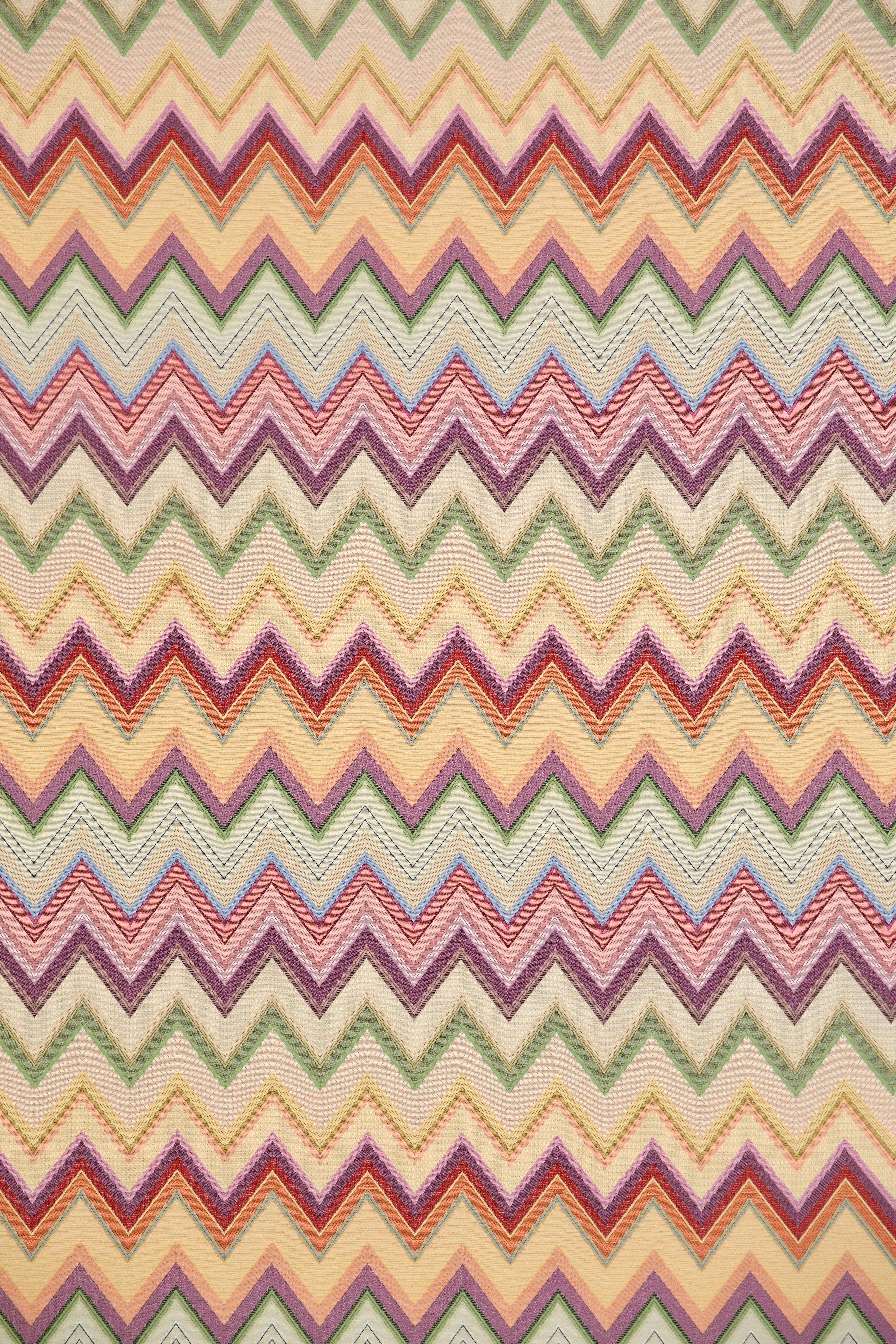 Missoni Home's cushion with a sophisticated palette of soft neutrals, chevrons are reinvigorated with removeable cover; 95/5 fill insert.
