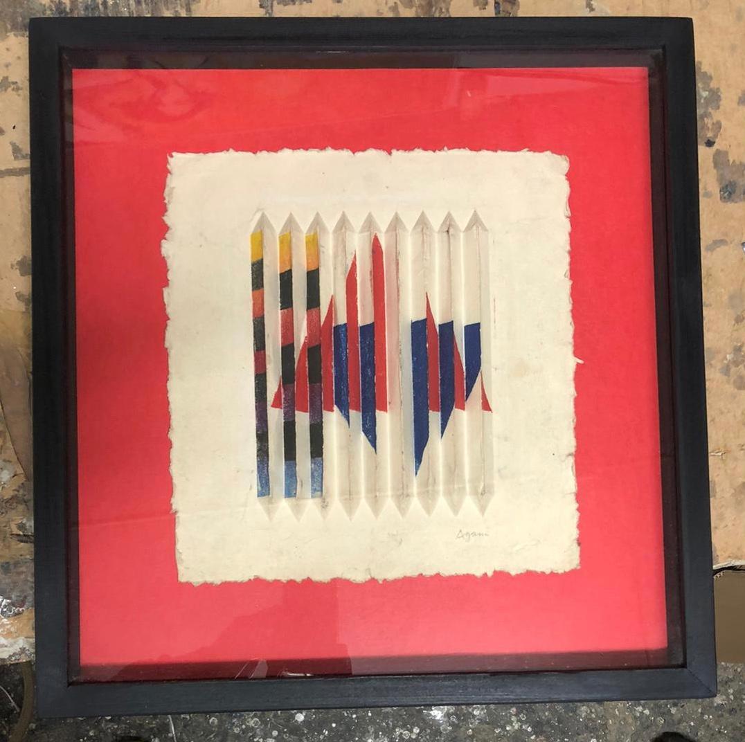 This unique kinetic piece by Yaacov Agam was done in the 70`s!! It is acrylic on paper mâché and it has all the Agam characteristics to it: It is 3D, coloured and kinetic.
It is hand signed on the lower right.
Please go over the images and see