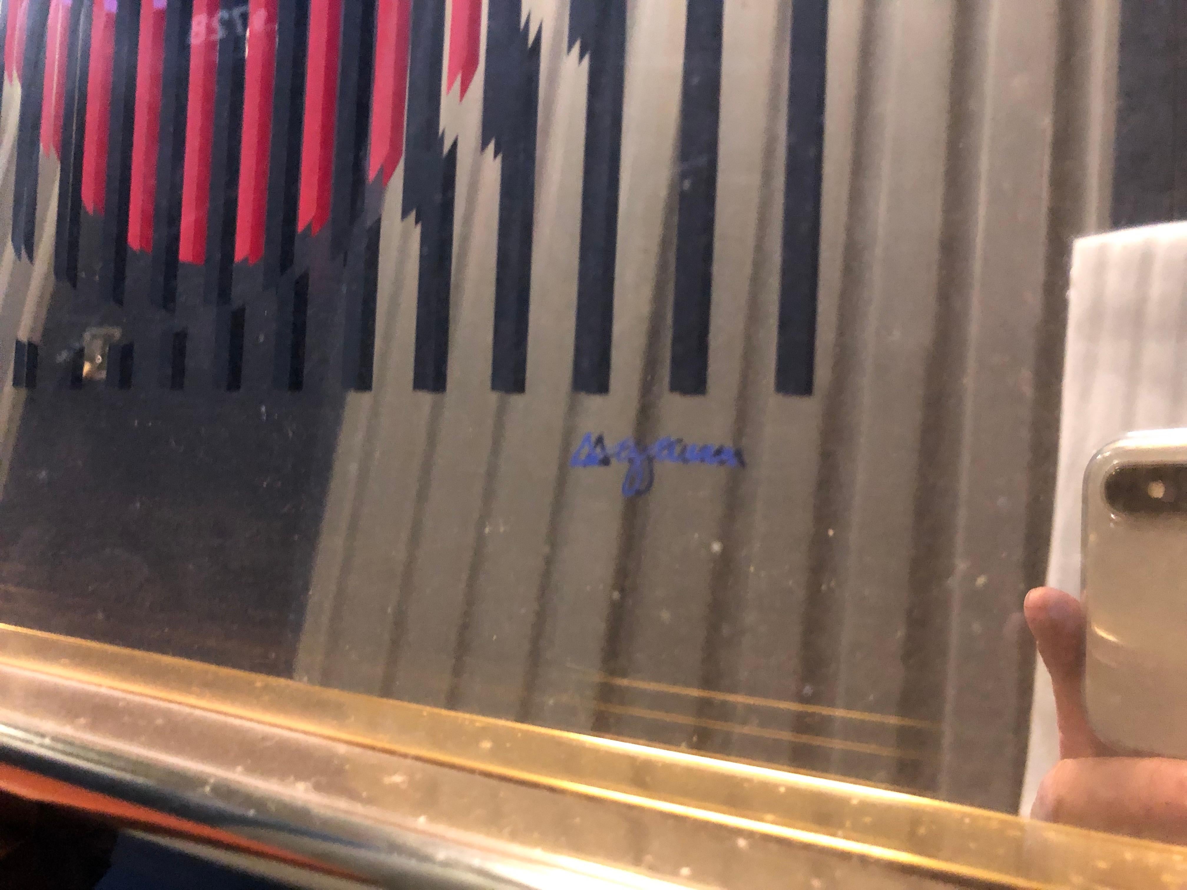 This rare serigraph on mirror by Yaacov Agam is a good example of the Agam`s multi colorful art pieces.
It is in very good condition, and comes framed in gold color that matches the work.
It is hand signed by Agam (L.R) and numbered 43/99