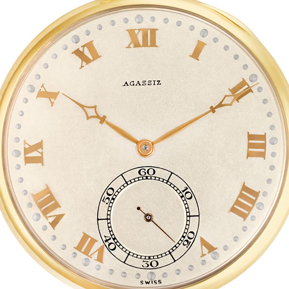 Agassiz Pocket Watch in 14k yellow gold. Manual w/ subseconds. Ref 246181. Fine Pre-owned Agassiz Watch.   Certified preowned Agassiz pocket watch 246181 watch is made out of yellow gold. This Agassiz watch has a 44  mm  case with a Round caseback