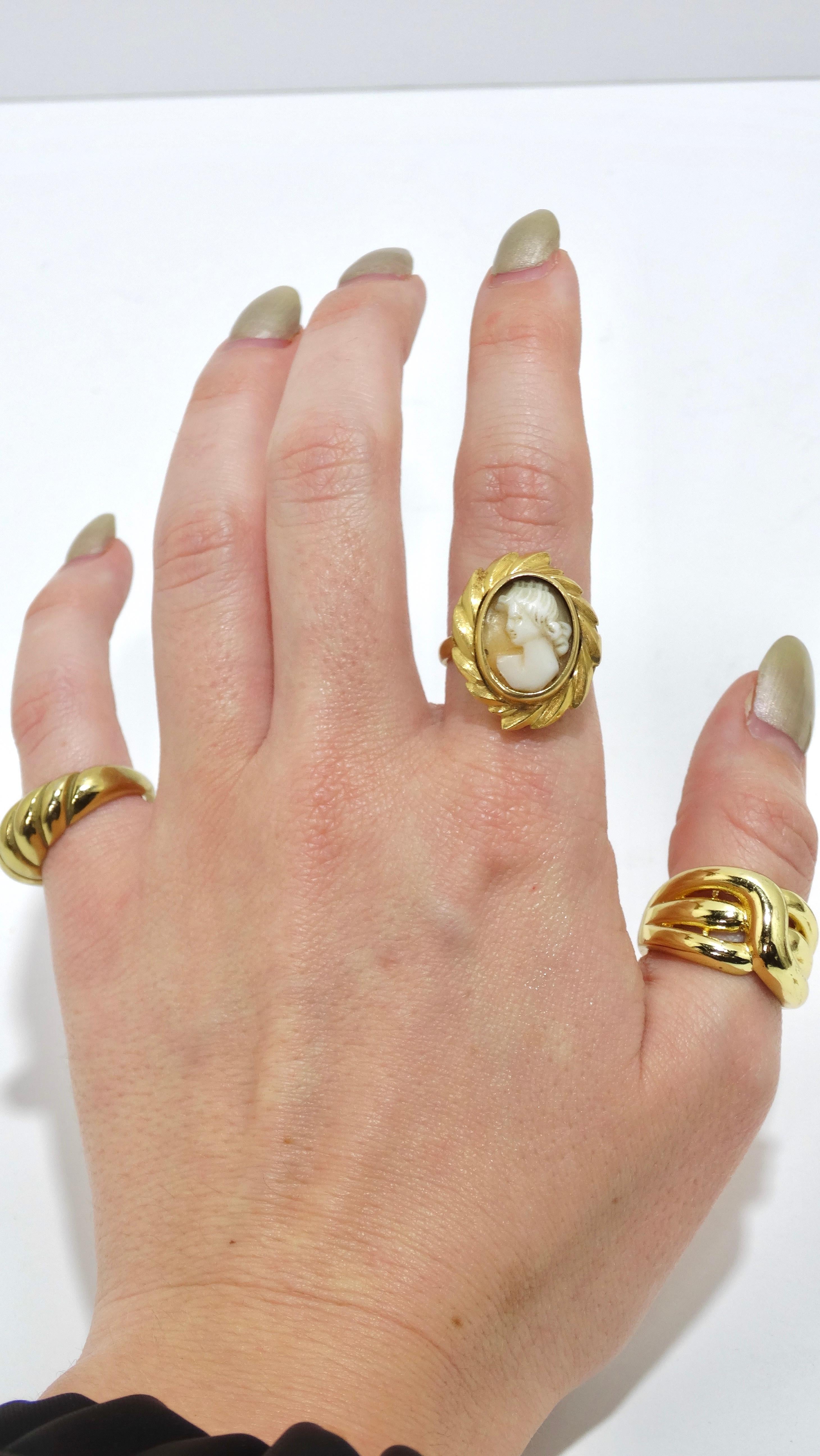 Pick a gem right out of the 1920's. This is an exquisite ring with a lady figure carved out of white agate surrounded by 18k gold. Add a sense of beauty and elegance to your jewelry collection and pair with more modern touches like Cartier rings and