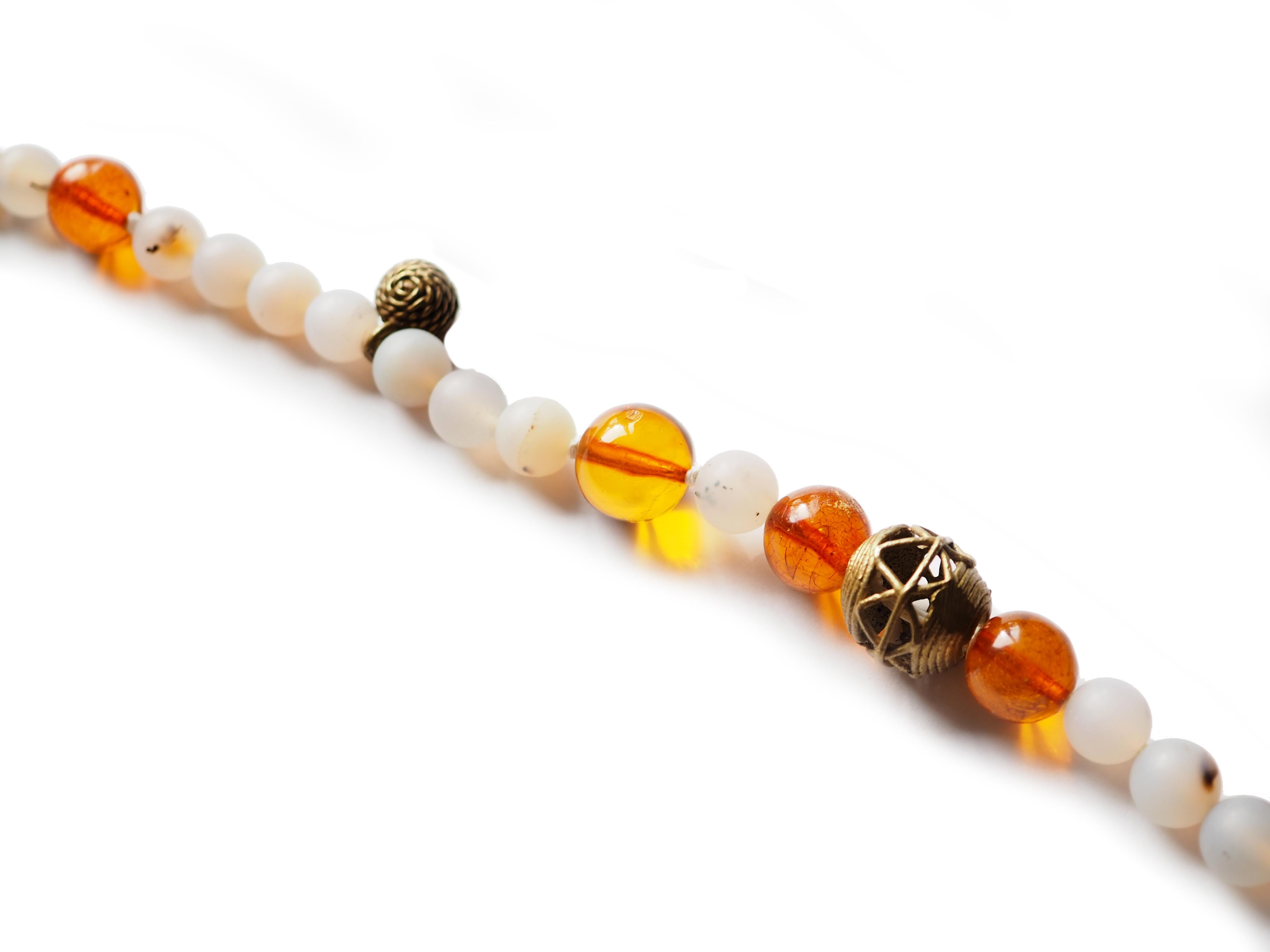 Long necklace with antique dzi agate stone antique African bronze element, amber, frozen agate bids. 80 cm long.
All Giulia Colussi jewelry is new and has never been previously owned or worn. Each item will arrive at your door beautifully gift