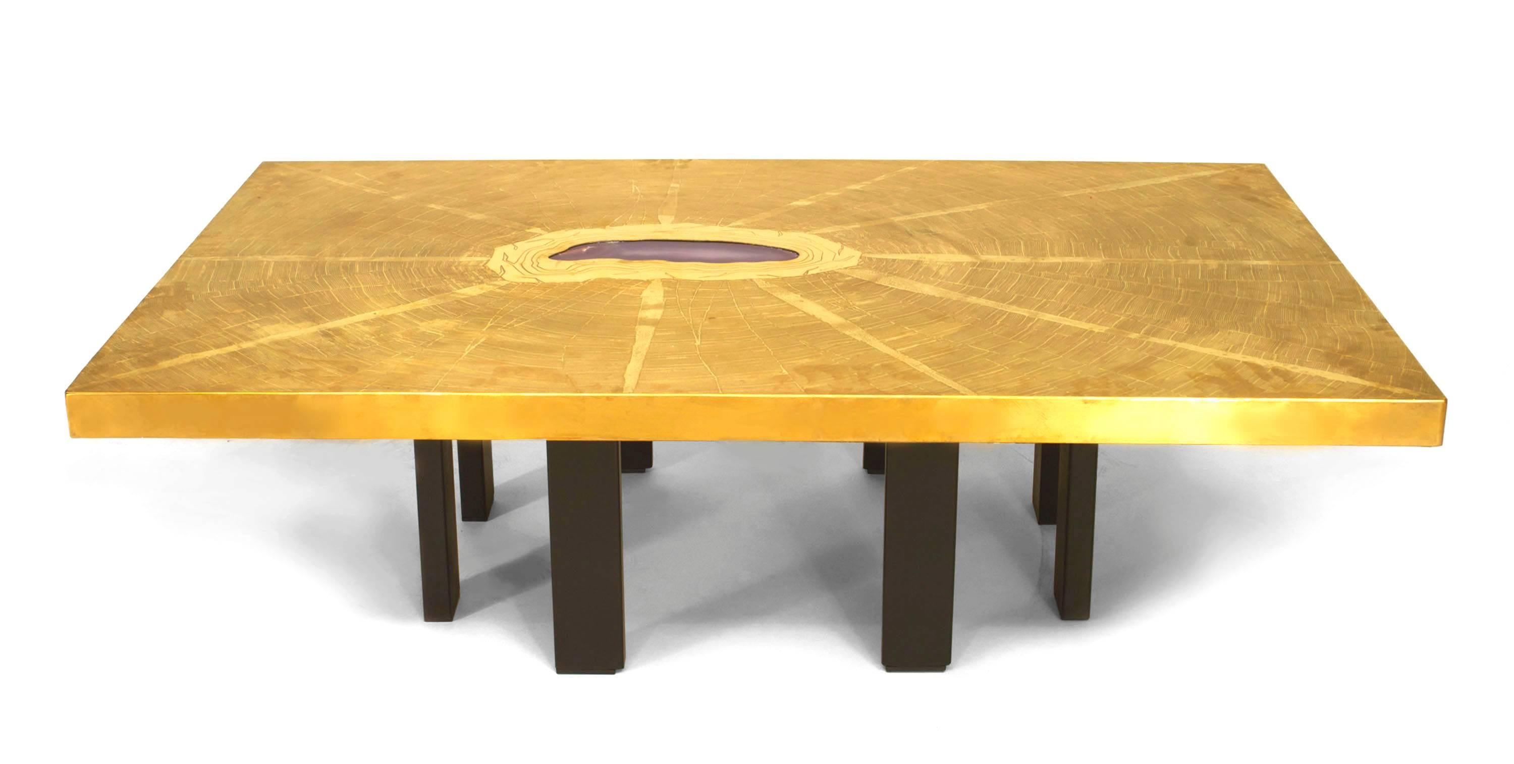 Dating to 1970's Belgium, this coffee table by Georges Mathias has a rectangular bronze top with an etched design radiating out from an inset agate center supported by a ring of rectangular ebonized legs.