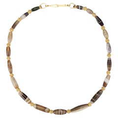 Used Agate Barrel Beads from the Bronze Age Alternating with Collared 22k Gold Beads
