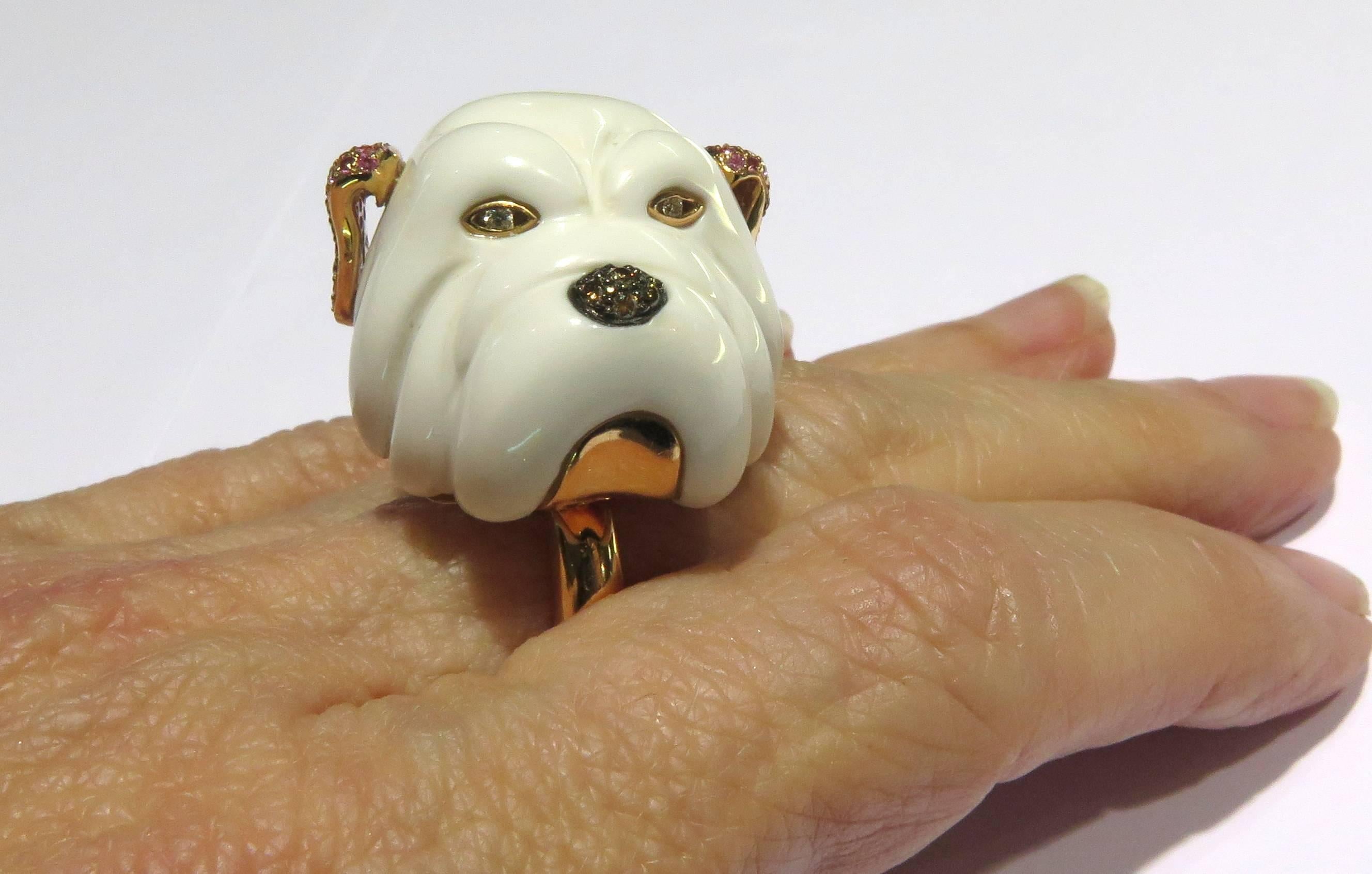 This adorable 18k rose gold over-sized dog ring is unique to all other dog rings. I'm not sure what kind of dog he is, but you will surely find him irresistible. With his brown diamond nose, his diamond eyes, and those amazing pink sapphire ears,