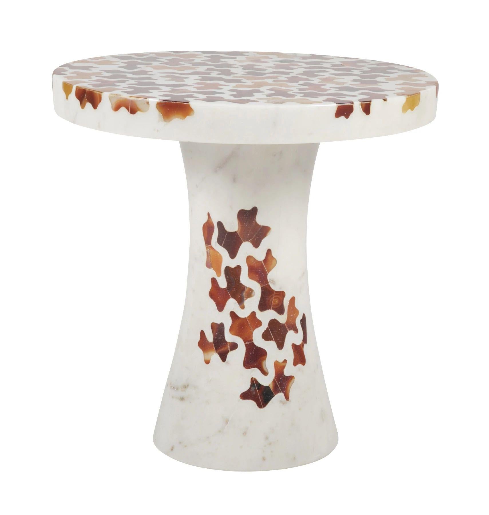 The Agate Jigsaw table is a part of the Ornamenti collection. Delicately cut rare pieces of agate are carefully inlaid into the base stone by our master craftsmen. The collection features modern designs using the Pietra Dura method originated in