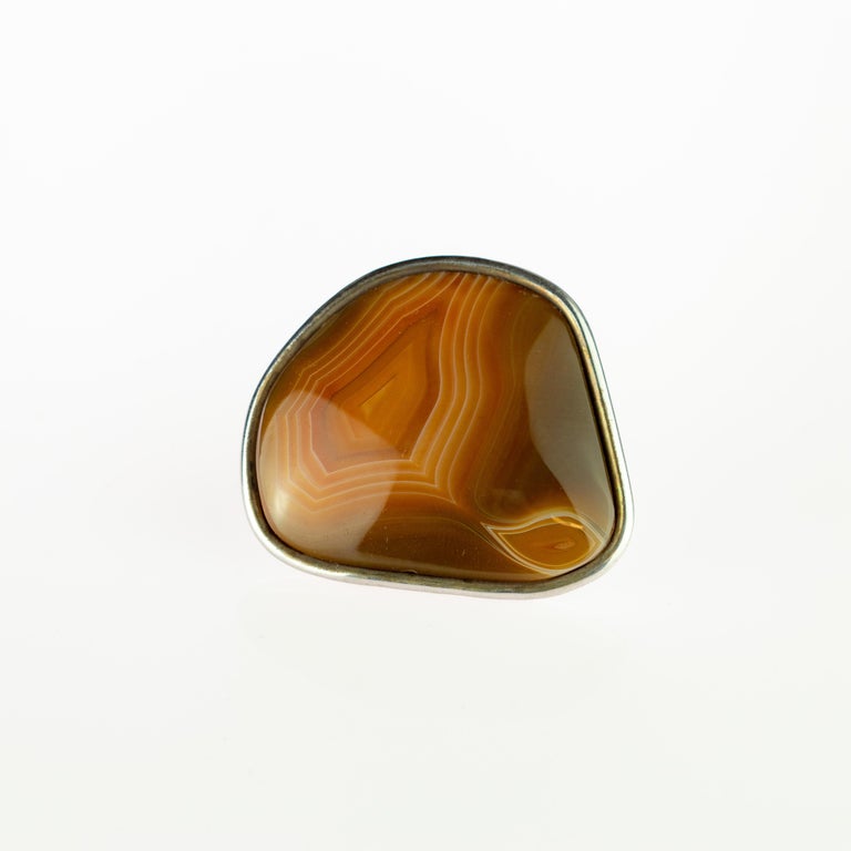Raw brown natural agate ring held by  925 sterling silver. A unique and marvelous uncut stone highlighted in an italian handmade cocktail jewel piece.
 
This unique agate stone ring makes such a statement. A handmade original Intini Jewels piece,