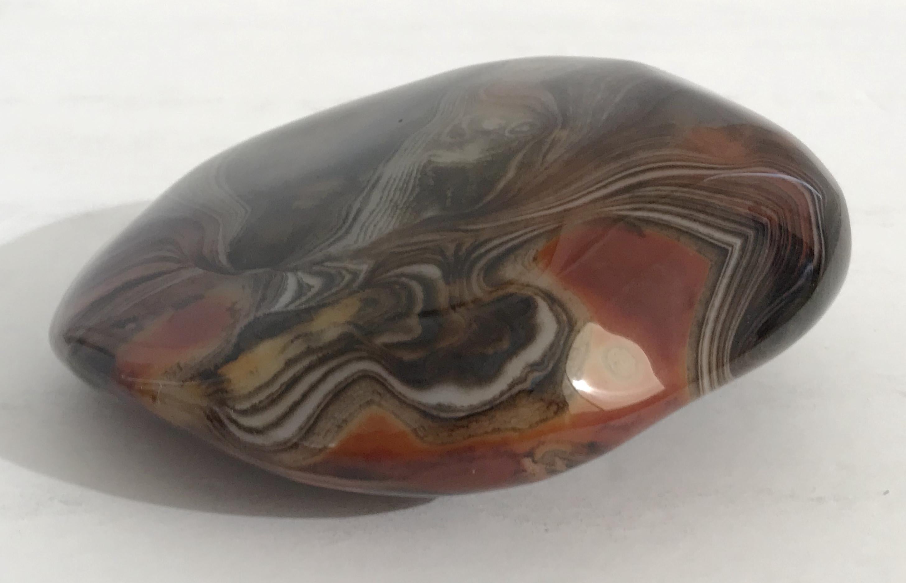 Hand polished agate onyx stone paperweight in black, brown, and red intricate layered patterns
Measures: length 4.75 inches, width 4.25 inches, height 2 inches
1 in stock in Palm Springs ON 50% OFF SALE for $225 !!
This piece makes for a great and