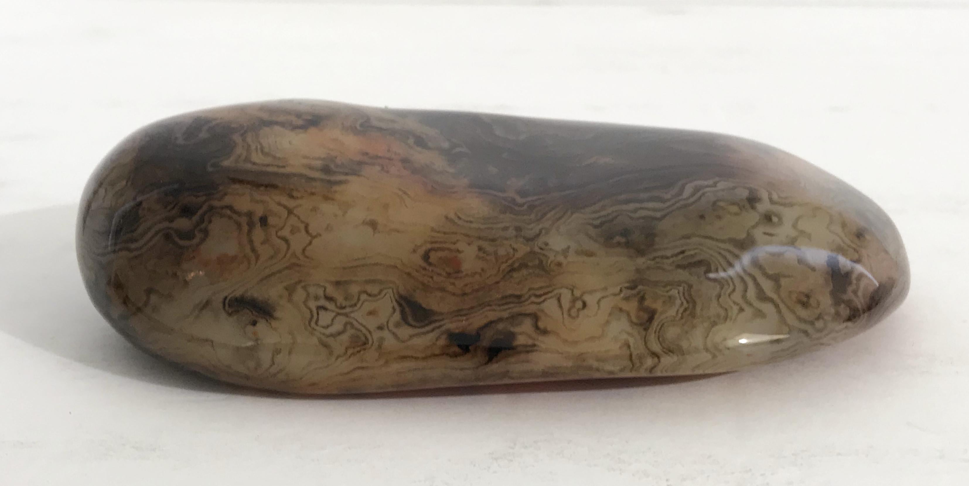 Hand polished agate onyx stone paperweight in black, brown, and red intricate layered patterns
Measures: length 5 inches, width 2.75 inches, height 1.25 inches
1 in stock in Palm Springs ON 50% OFF SALE for $225 !!
This piece makes for a great and