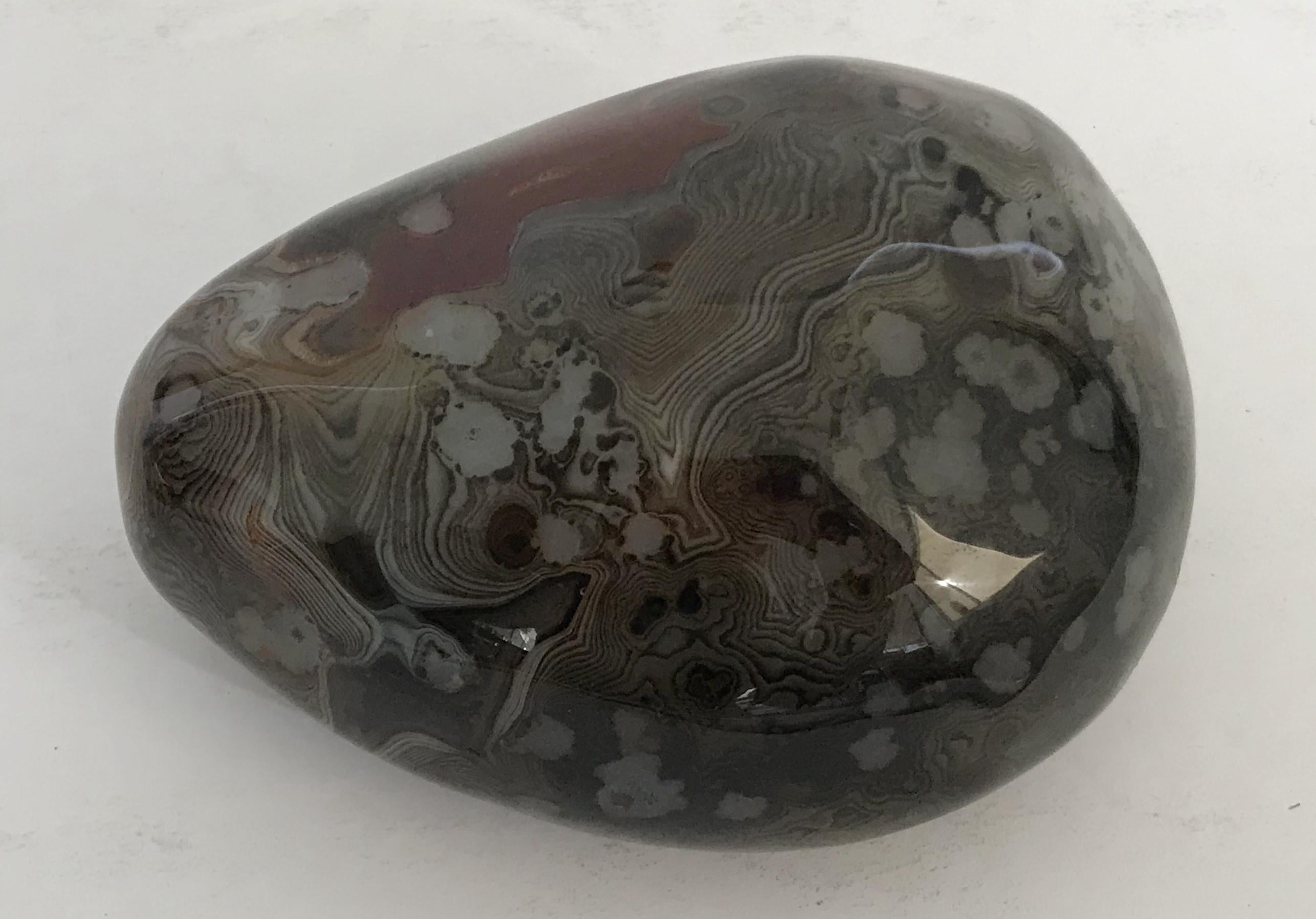 Hand polished agate onyx stone paperweight in black, brown, and red intricate layered patterns
Measures: length 4 inches, width 3 inches, height 2 inches
1 in stock in Palm Springs ON 50% OFF SALE for $225 !!
This piece makes for a great and unique