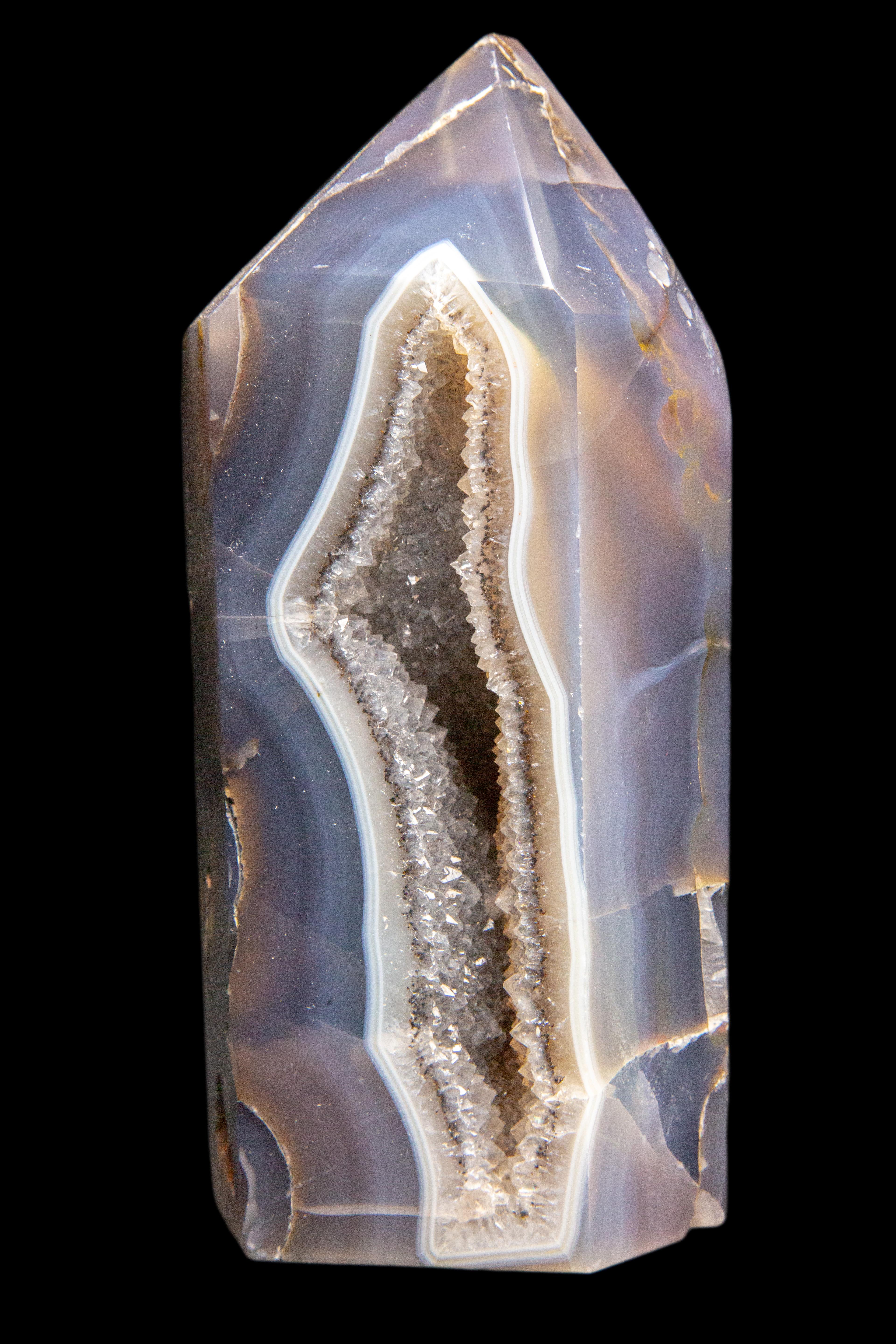 Agate Geode Point: is a geological secondary formation within sedimentary and volcanic rocks. Geodes are hollow, vaguely spherical rocks, in which masses of mineral matter (which may include crystals) are secluded. The crystals are formed by the