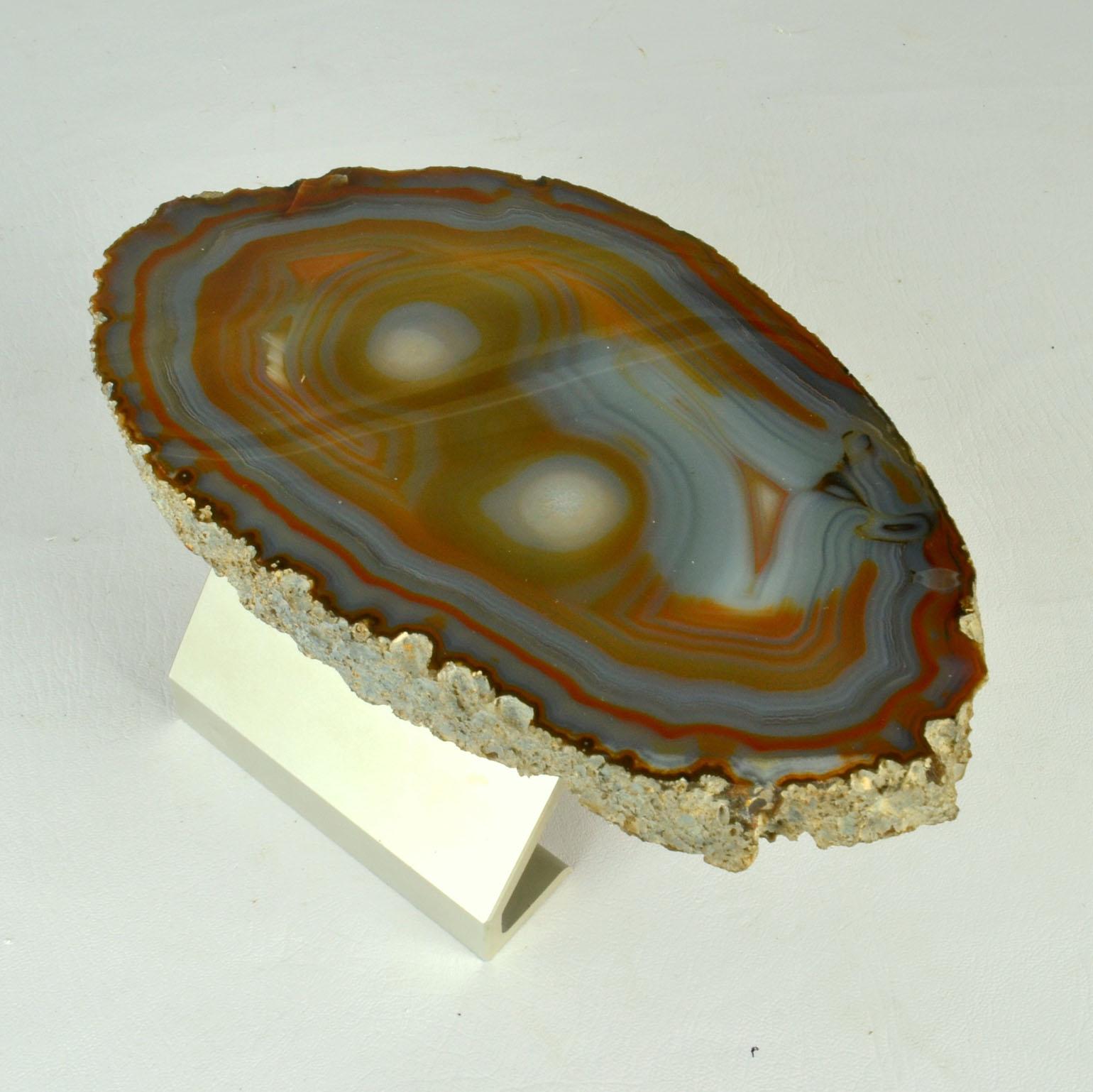 Solid Agate push and pull door handle in an organic pattern in a range of colors from grey's to ocher and from orange greens. The semi precious stone handle is attaches to an aluminum bracket by two fixings and will be fitted to the door with two