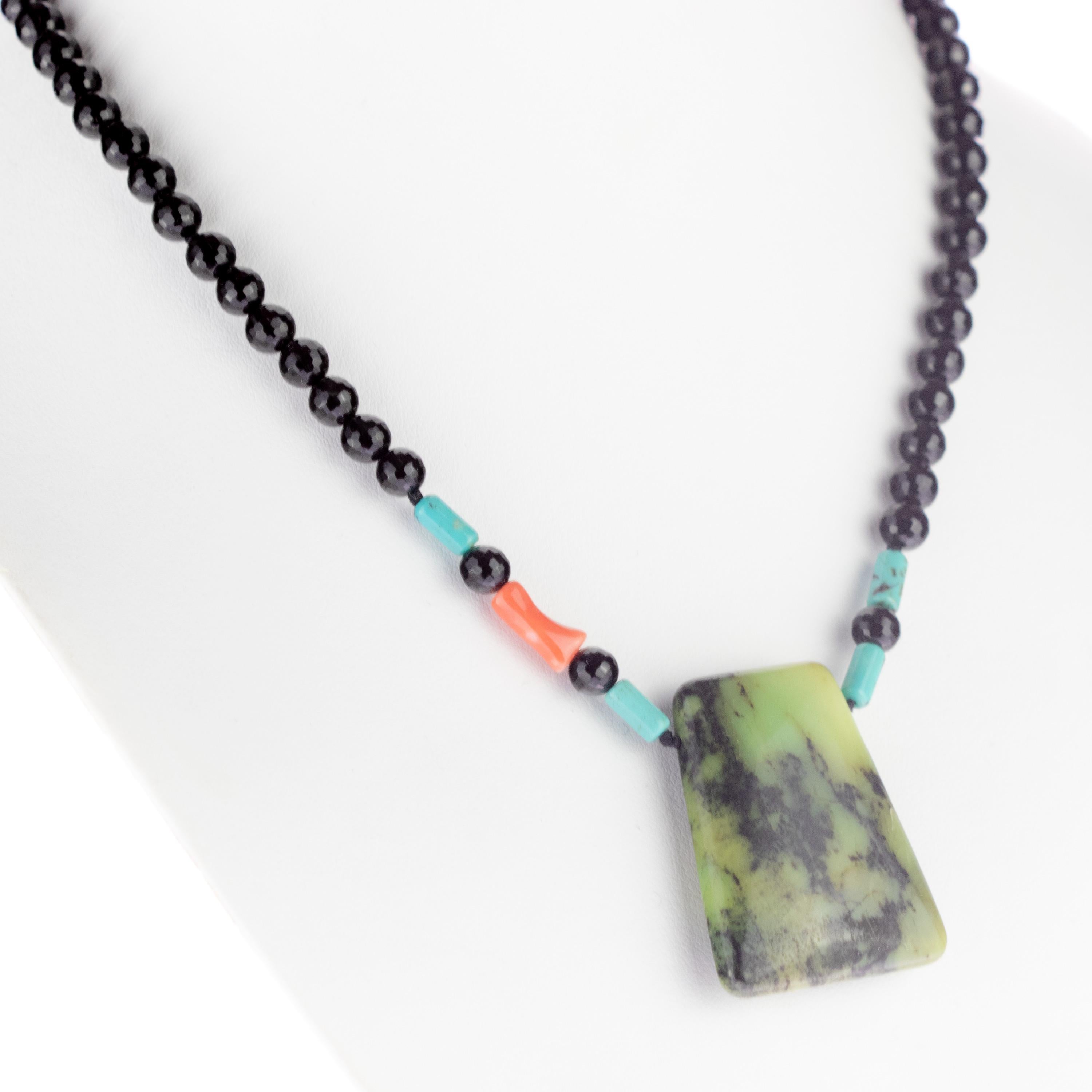 A unique design made with black Agate, Turquoise, Coral and a central pendant of Chrysoprase.

Handmade in Italy with fine precious stones, ethical and natural.

Fits with elegant outfits as well as for a casual look.

Enjoy the brightness of
