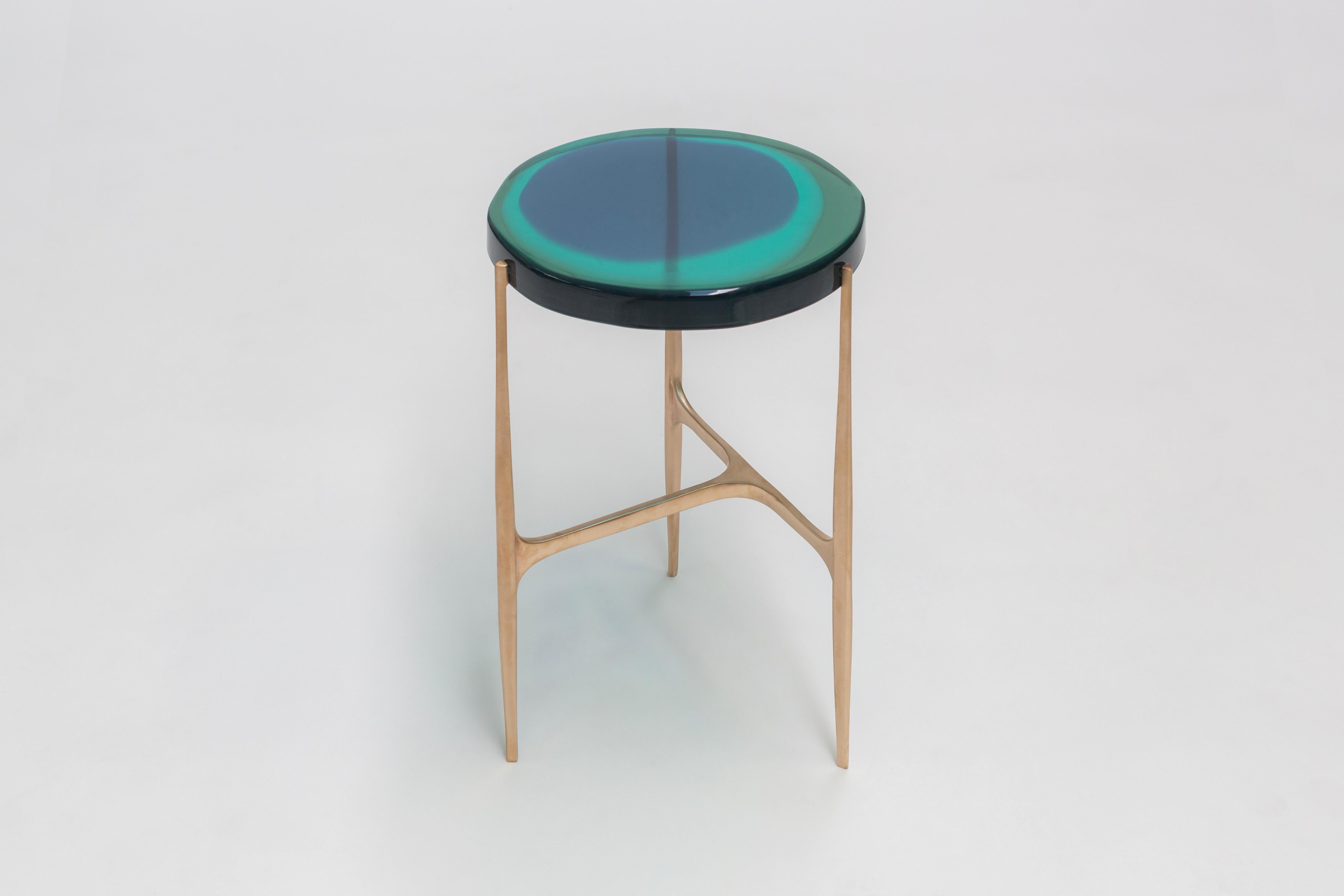 Agatha coffee table by Draga & Aurel
Dimensions: W 34 x D 34 x H 50
 top Ø 34 cm
Materials: Resin, bronze

The Agatha coffee tables are featured by irregular circular tops of transparent and
colorful resin sit on a bronze frame with a