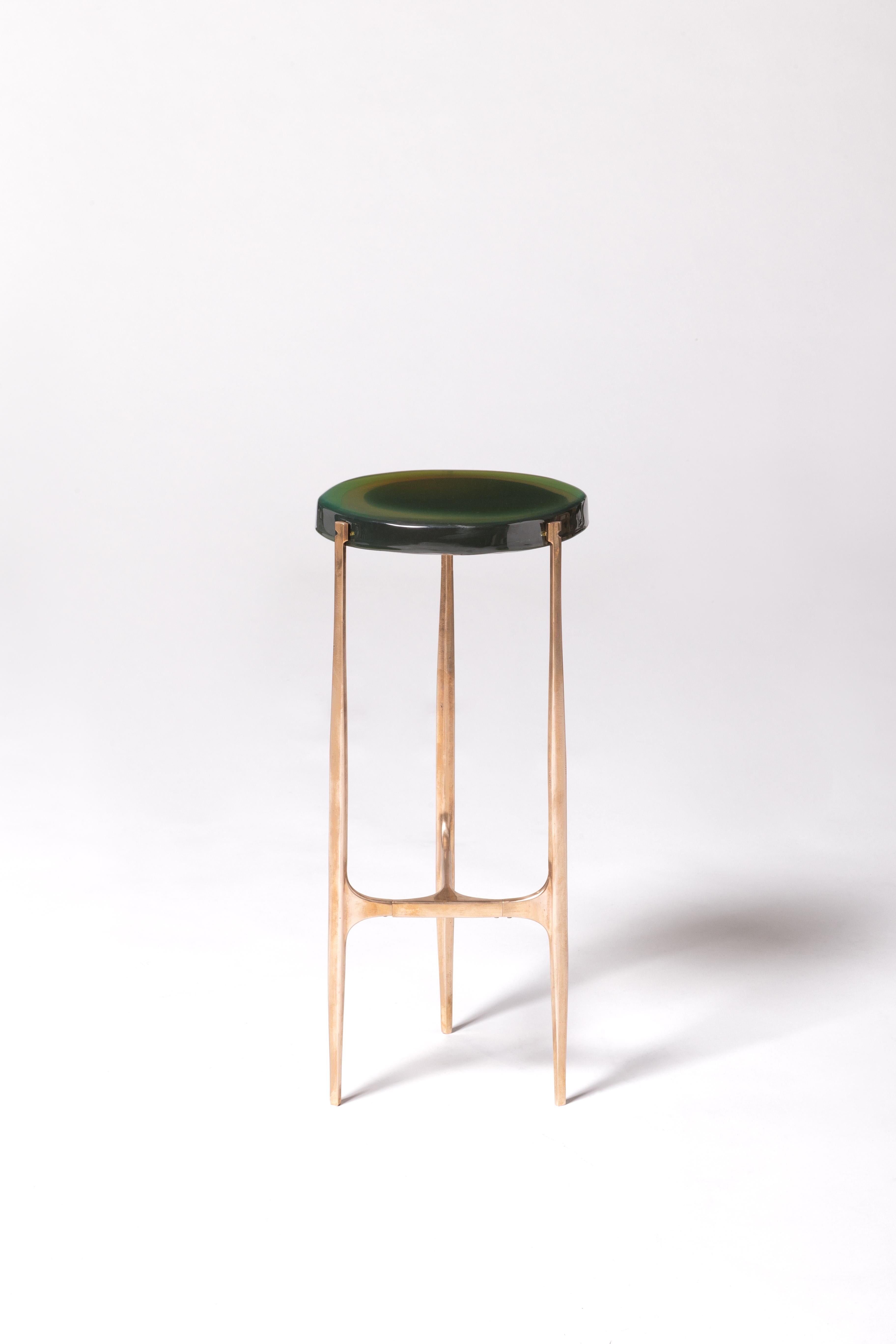 Agatha coffee table by Draga & Aurel
Dimensions: W 24 x D 24 x H 56
 top Ø 34 cm
Materials: Resin, bronze

The Agatha coffee tables are featured by irregular circular tops of transparent and
colorful resin sit on a bronze frame with a
