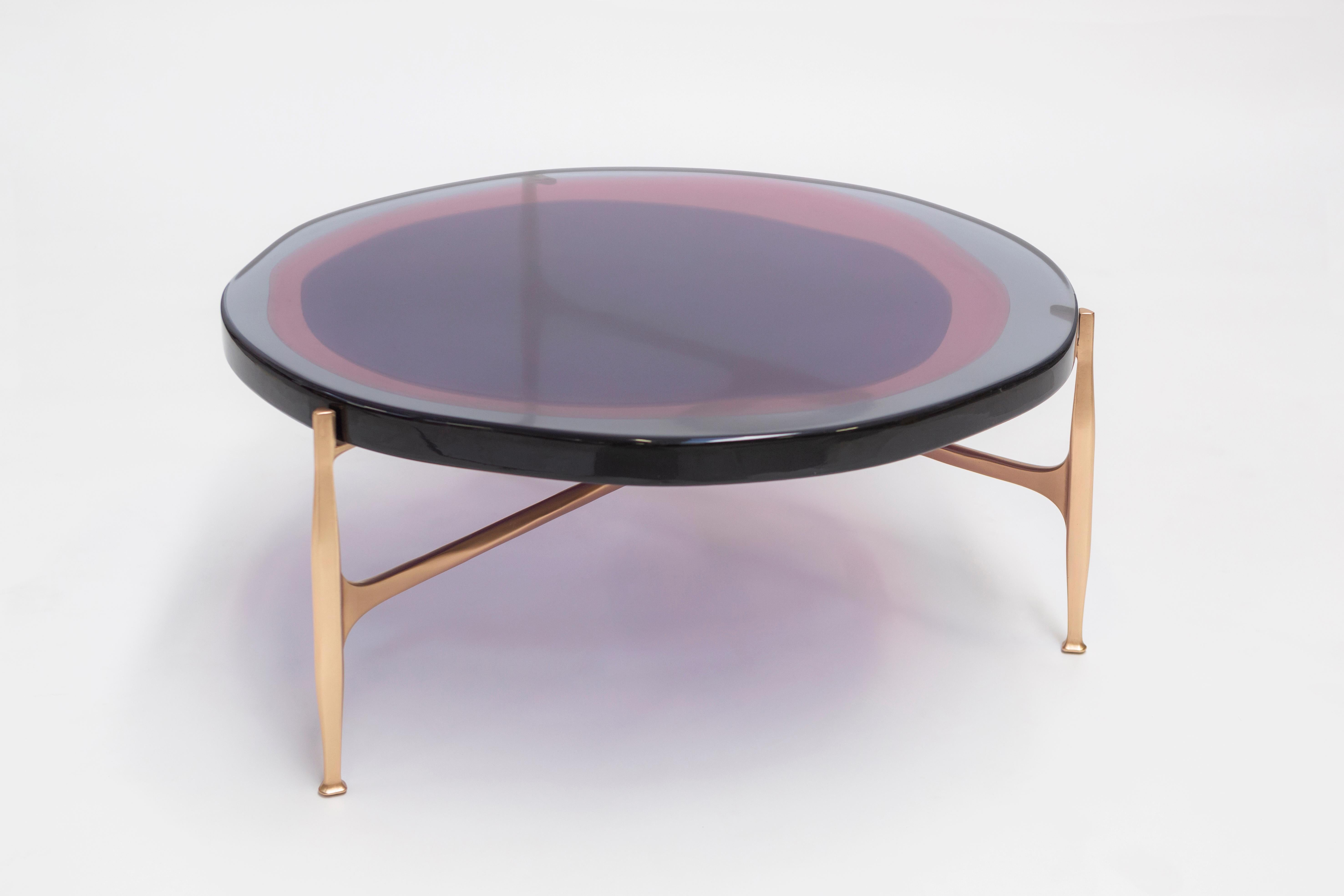 Agatha coffee table by Draga & Aurel
Dimensions: W 90 x D 90 x H 36
 Top Ø 90 cm
Materials: Resin and bronze

The Agatha coffee tables are featured by irregular circular tops of transparent and
colorful resin sit on a bronze frame with a