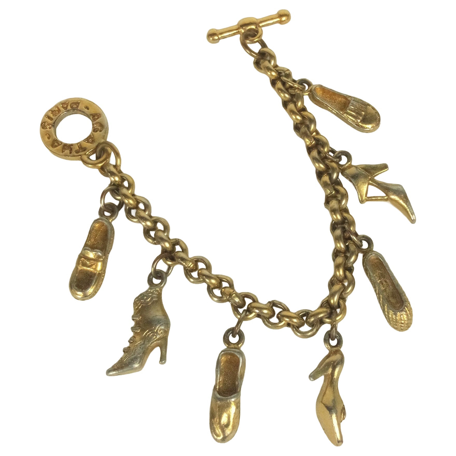 Agatha Paris Pulsera con dije de zapato dorado en venta