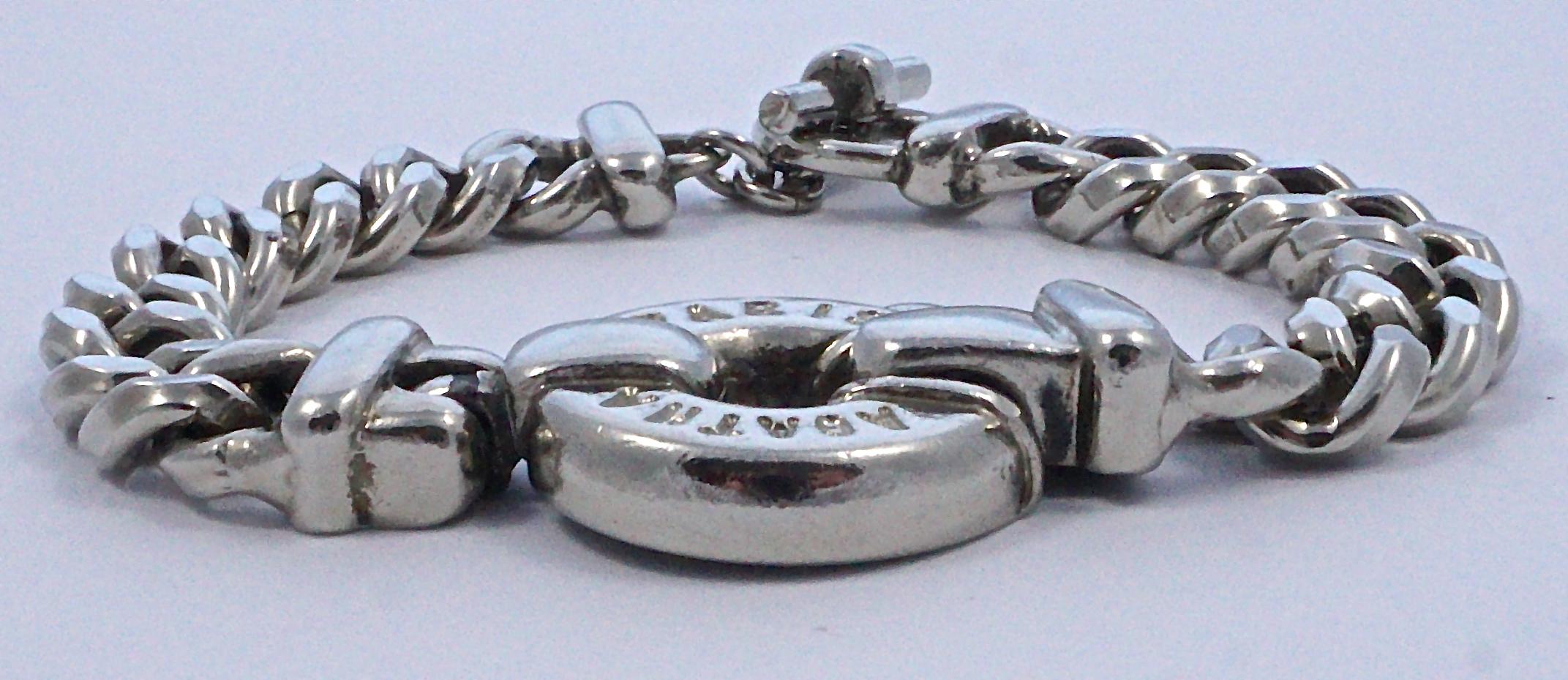 Agatha Paris fashionable silver tone curb link chain bracelet, featuring a chunky round centre medallion stamped Agatha Paris, and a toggle clasp. Measuring length 20.5cm / 8.07 inches by width 1cm / .39 inch, and the medallion is diameter 2.5cm /