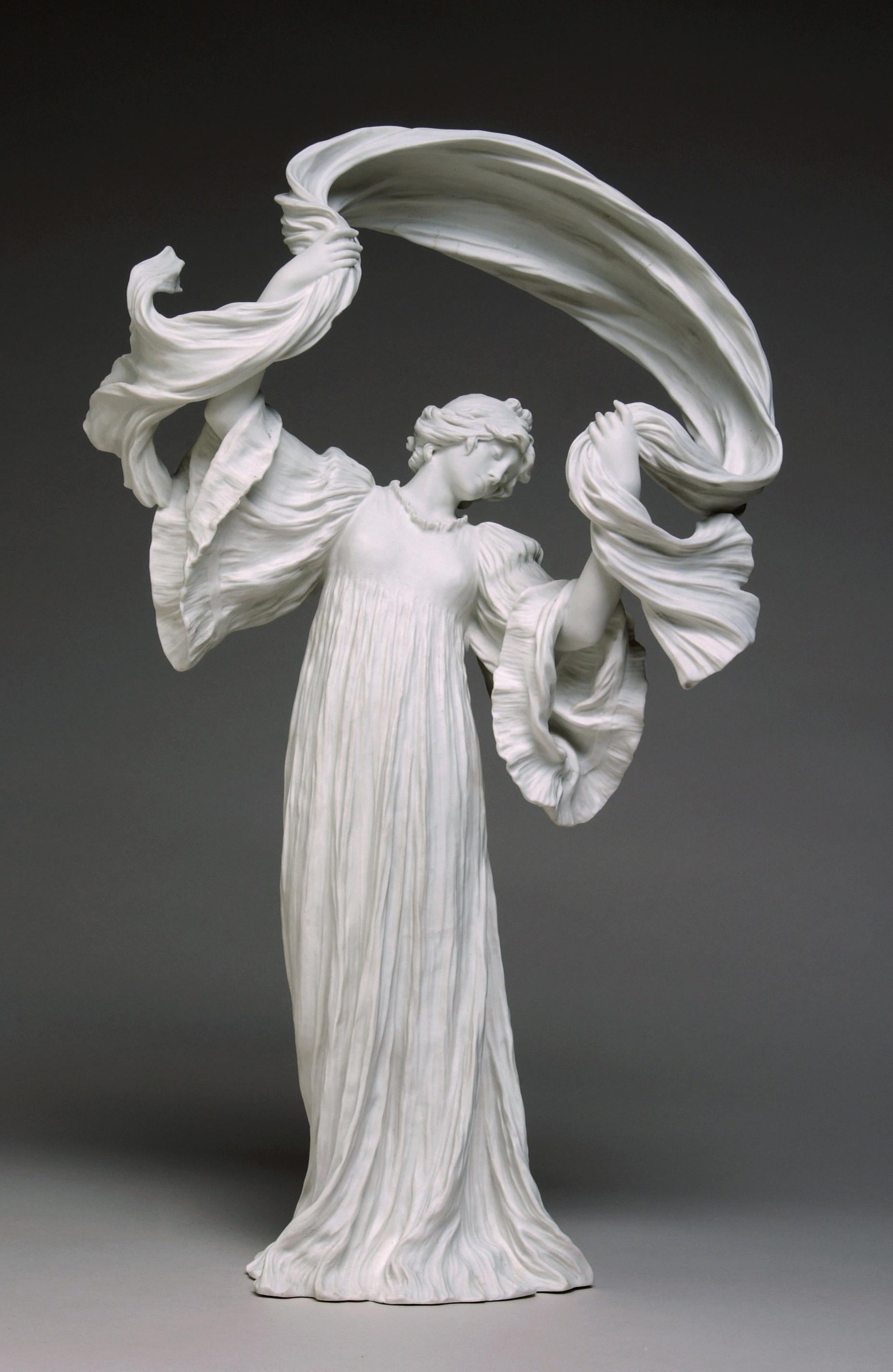 This work is a part of 'The Scarf Game'—a centerpiece consisting of 15 different sculptures of dancers. Art Nouveau influences dominate the collection, with clear motifs and references to nature and femininity. The sculptor, Agathon Léonard,