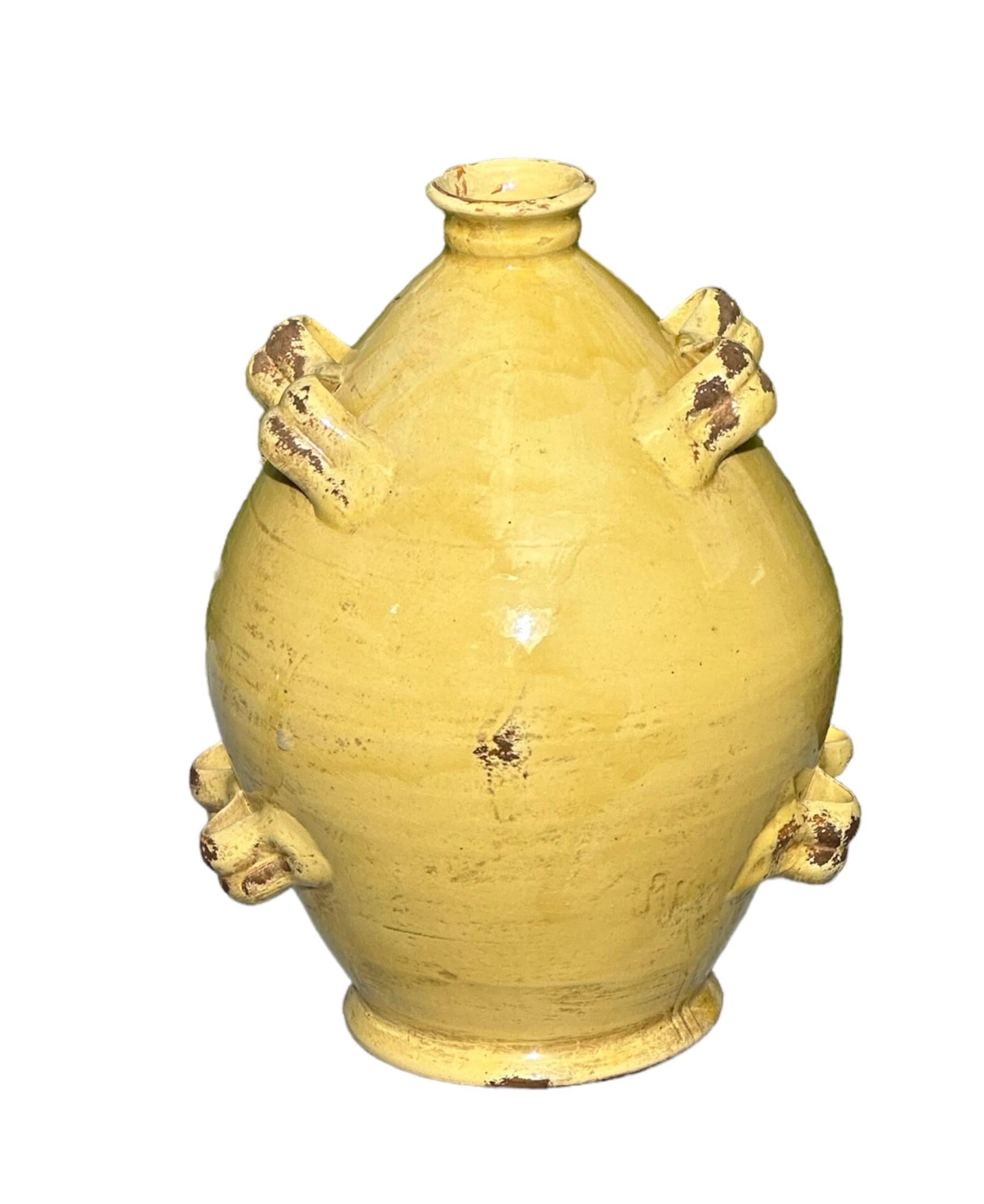 
A very unique jug with spout, the crest is what makes this earthly piece have such a regal feel. The patina is charming and the glaze looks like glass, so there’s two different feelings to the touch. It’s heavy and weight 

The color in the