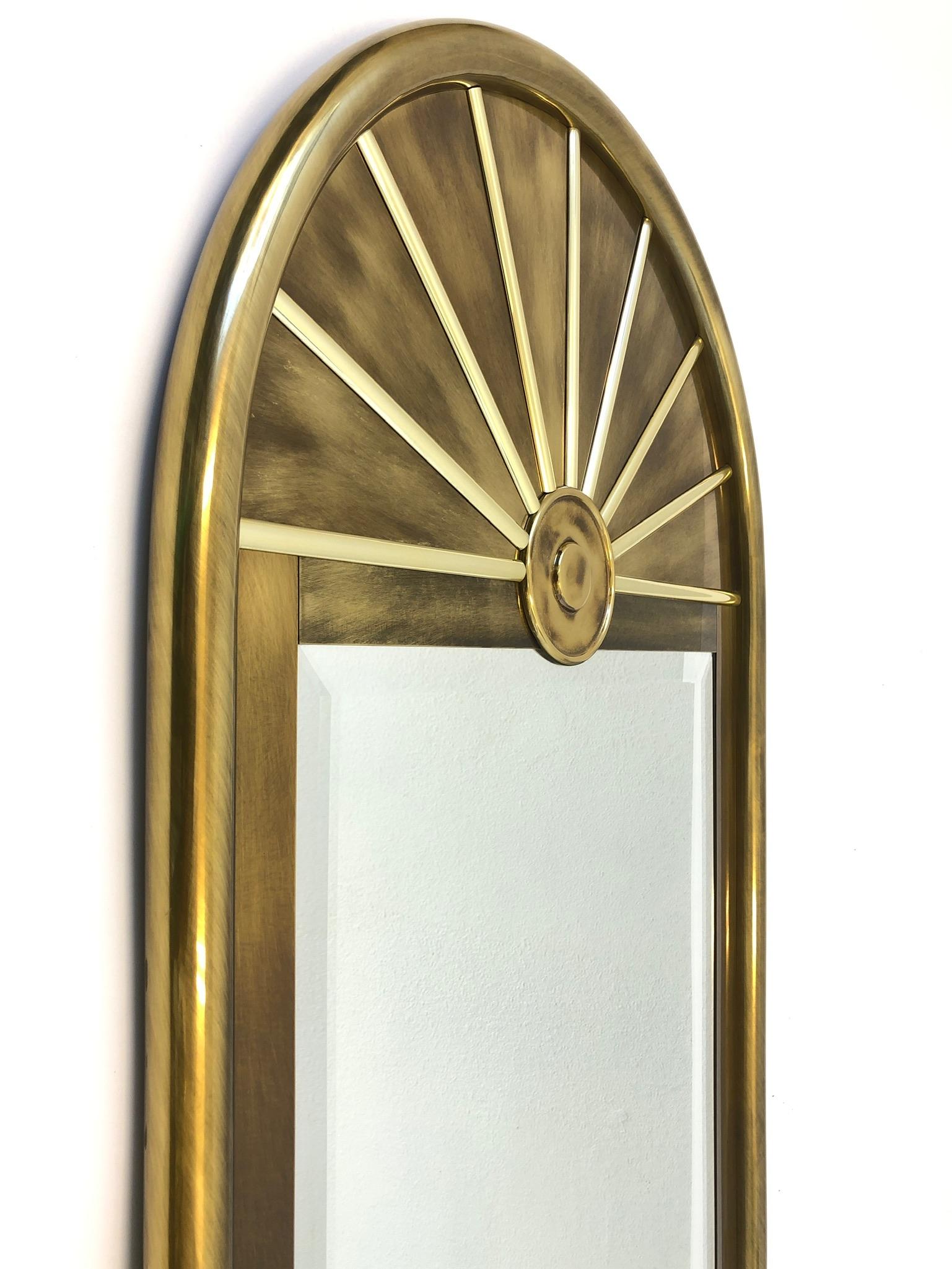Beautiful 1970s aged brass beveled mirror by Mastercraft. 
The mirror is in original condition, so it shows minor wear consistent with age. 
Measurements: 56” high, 28” wide and 1.75” deep.