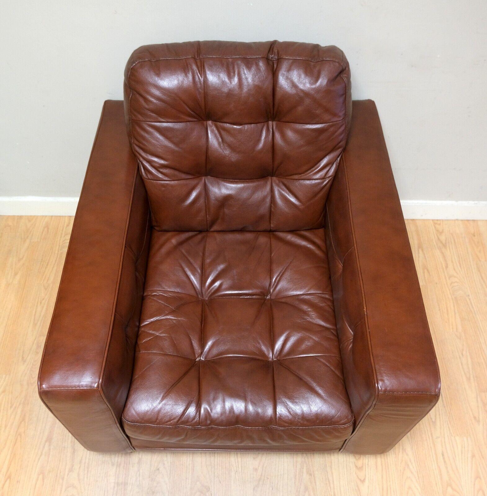 We are delighted to offer for sale this lovely Knoll style brown leather armchair with chesterfield style buttoning. 

This piece is good looking and super comfortable, everything compliments with the soft leather. The Knoll style makes it very