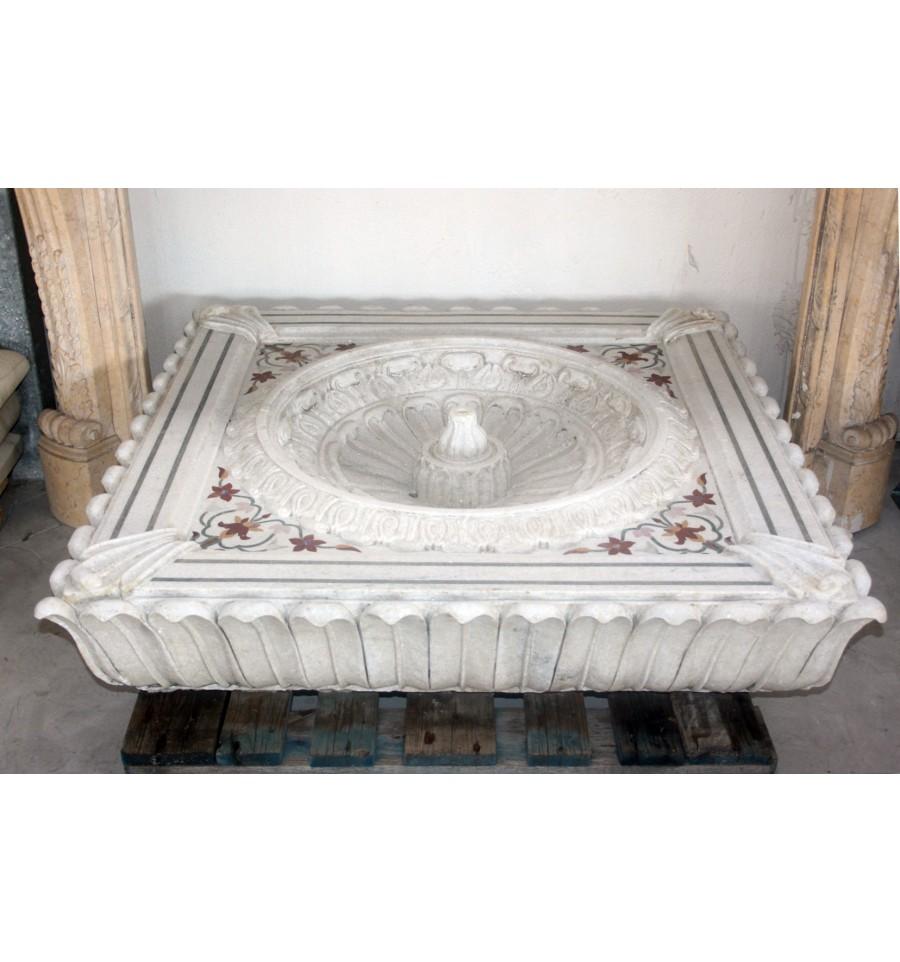 Aged marble floor fountain with inlay mosaic.