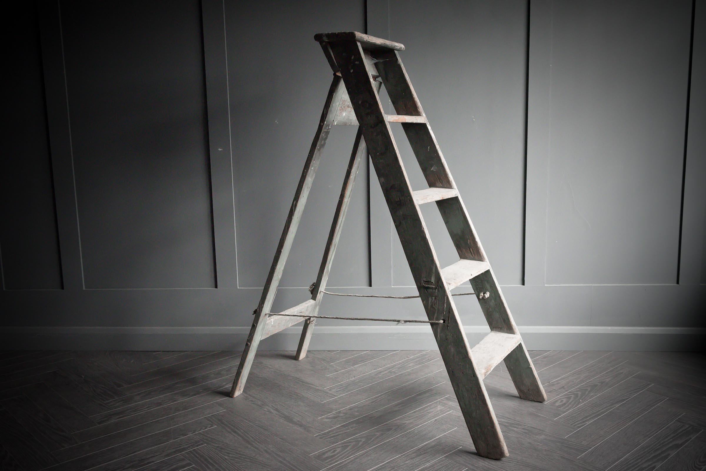 black wooden step ladder