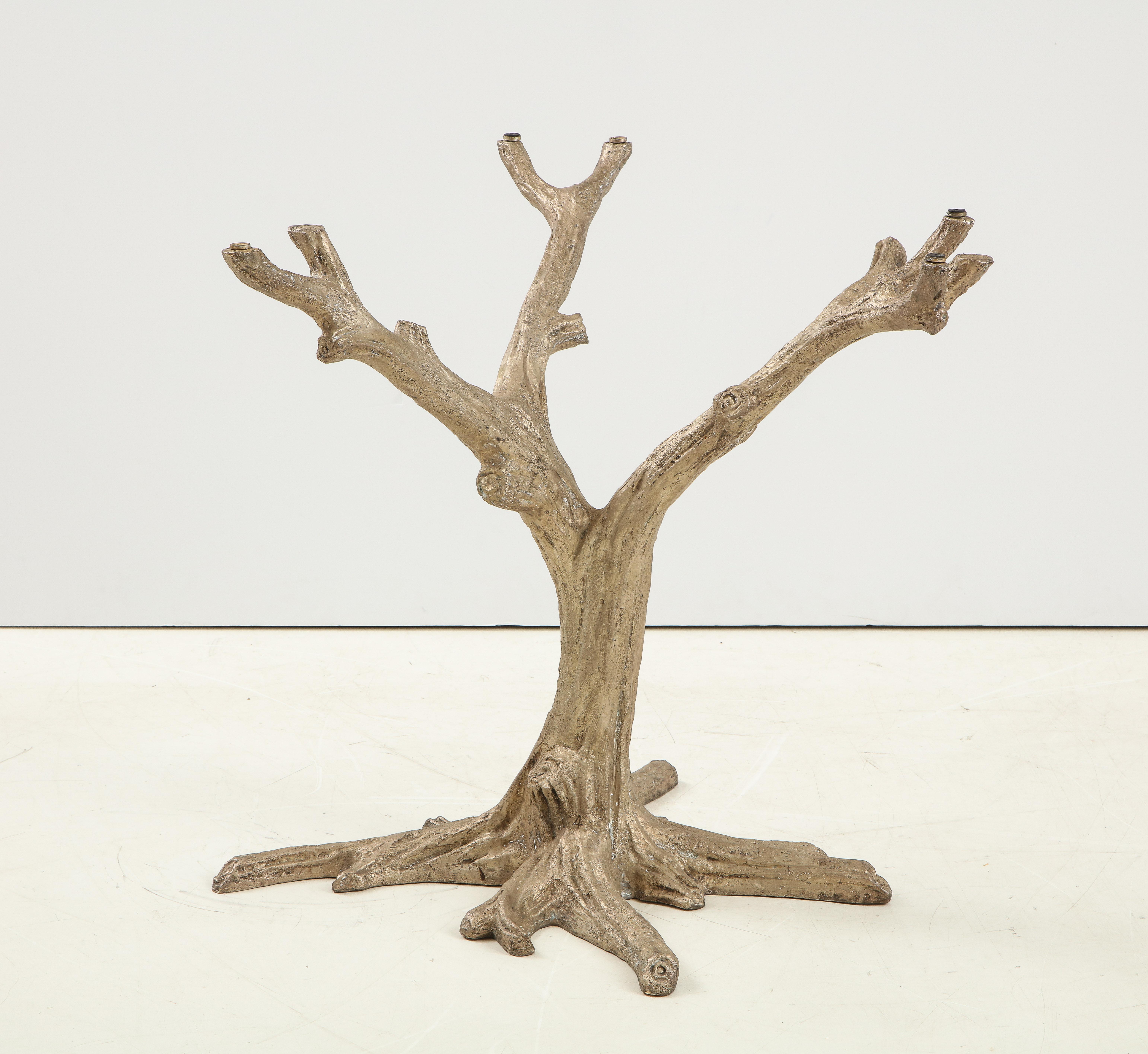 Striking aged silver toned bronze table base in a stylized tree form with branch supports. Can support a top up to 54