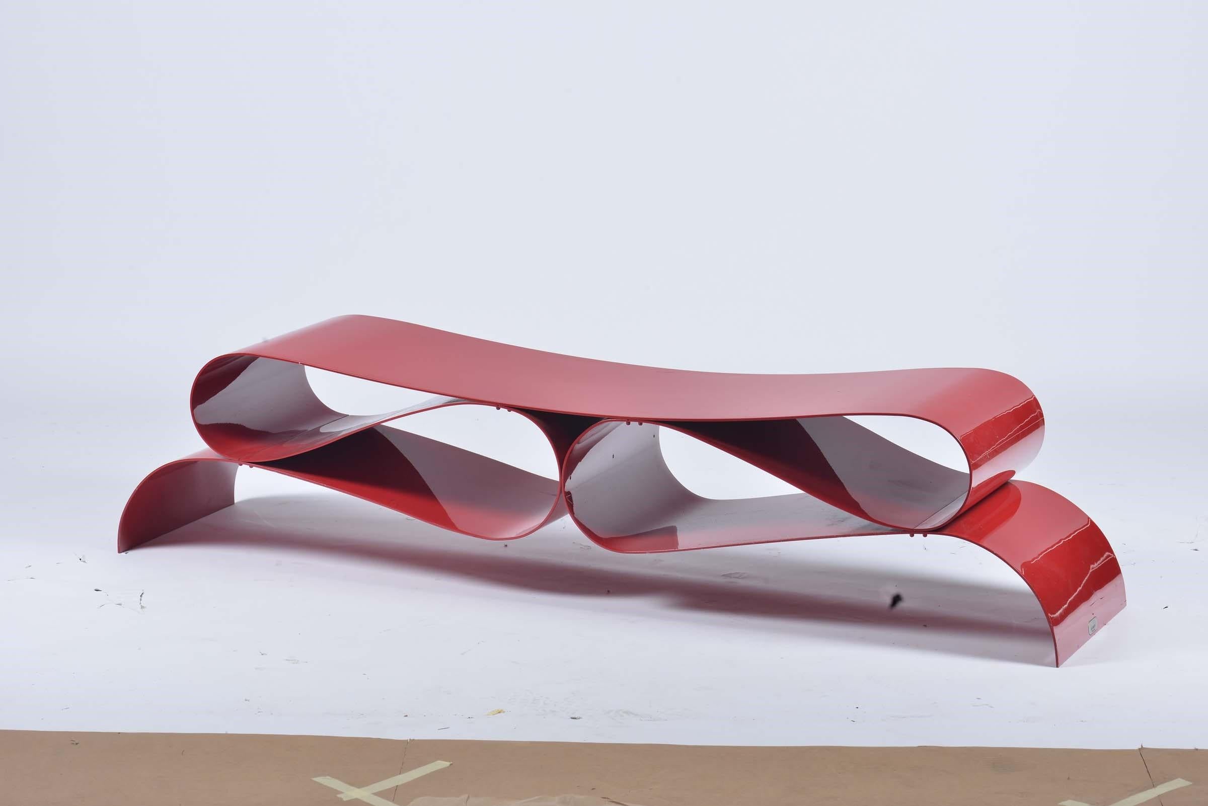 A beautiful lacquered red metal bench designed by Agenore Fabbri and produced by Tecno, Italy, 1985.

Biography
Agenore Fabbri was born in a small town located between the cities of Pistoia, where he was educated, and Firenze where he came into