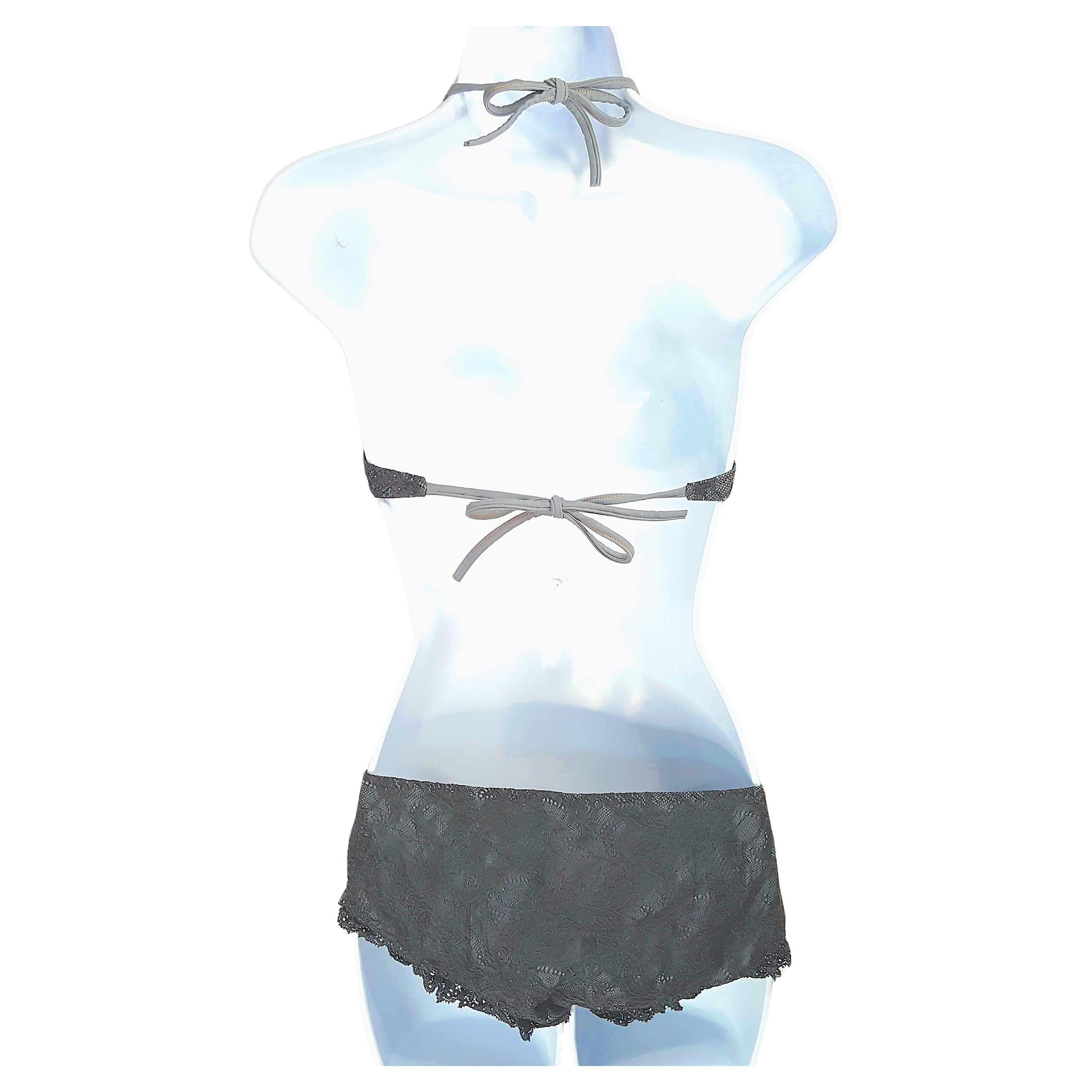 Vivienne Westwood's son Joe Corre opened the first lingerie boutique for his sexy London-based brand Agent Provocateur in Soho in the mid-1990s, when the sole owner of this black lace-overlay and lace-trimmed swimwear set acquired it. Ideal for