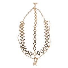 Tocado dorado en forma de diamante Agent Provocateur