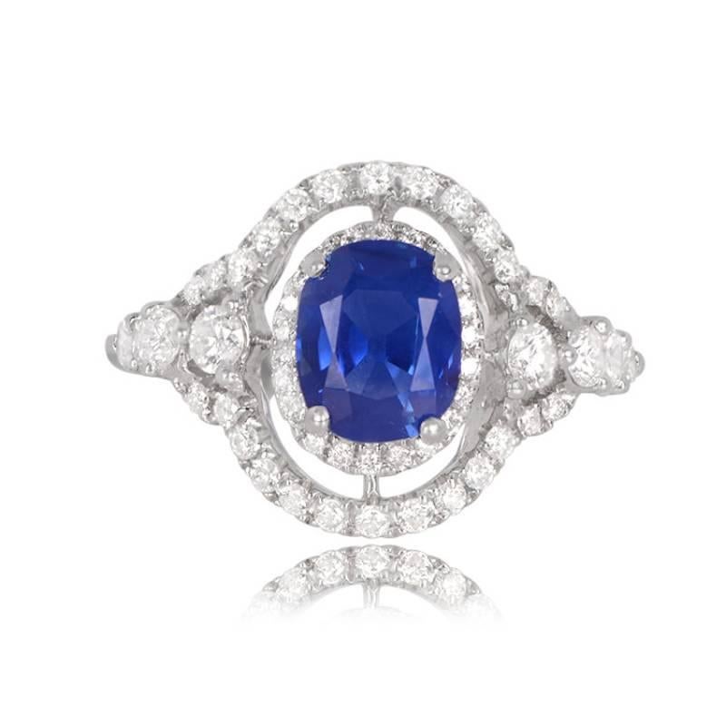 A stunning sapphire ring with a rare 1.81-carat Kashmir sapphire, known for its intense blue saturation. The center stone is surrounded by two diamond halos and set in 18k white gold. Kashmir sapphires of this color quality are exceptionally