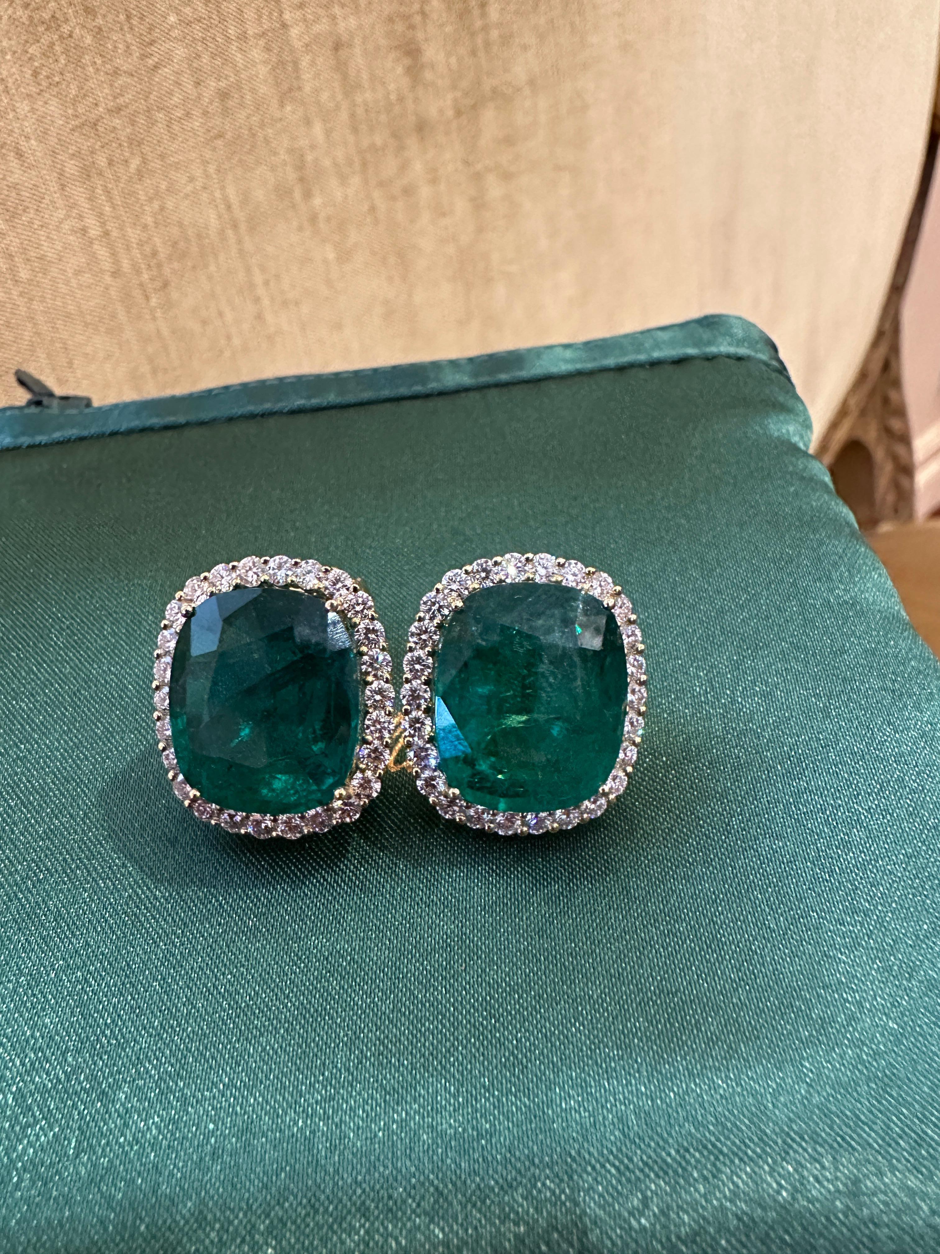 Large Emerald and Diamond Earrings in 18k Yellow Gold
Features
Two Natural Cushion Shaped Emeralds
weighing  29.15 carats total
Measurements:
17.23 x 14.60 x 8.98mm
and
16.80 x 14.58 x 8.05mm

AGL Certified
*See copy of the AGL certificate in the