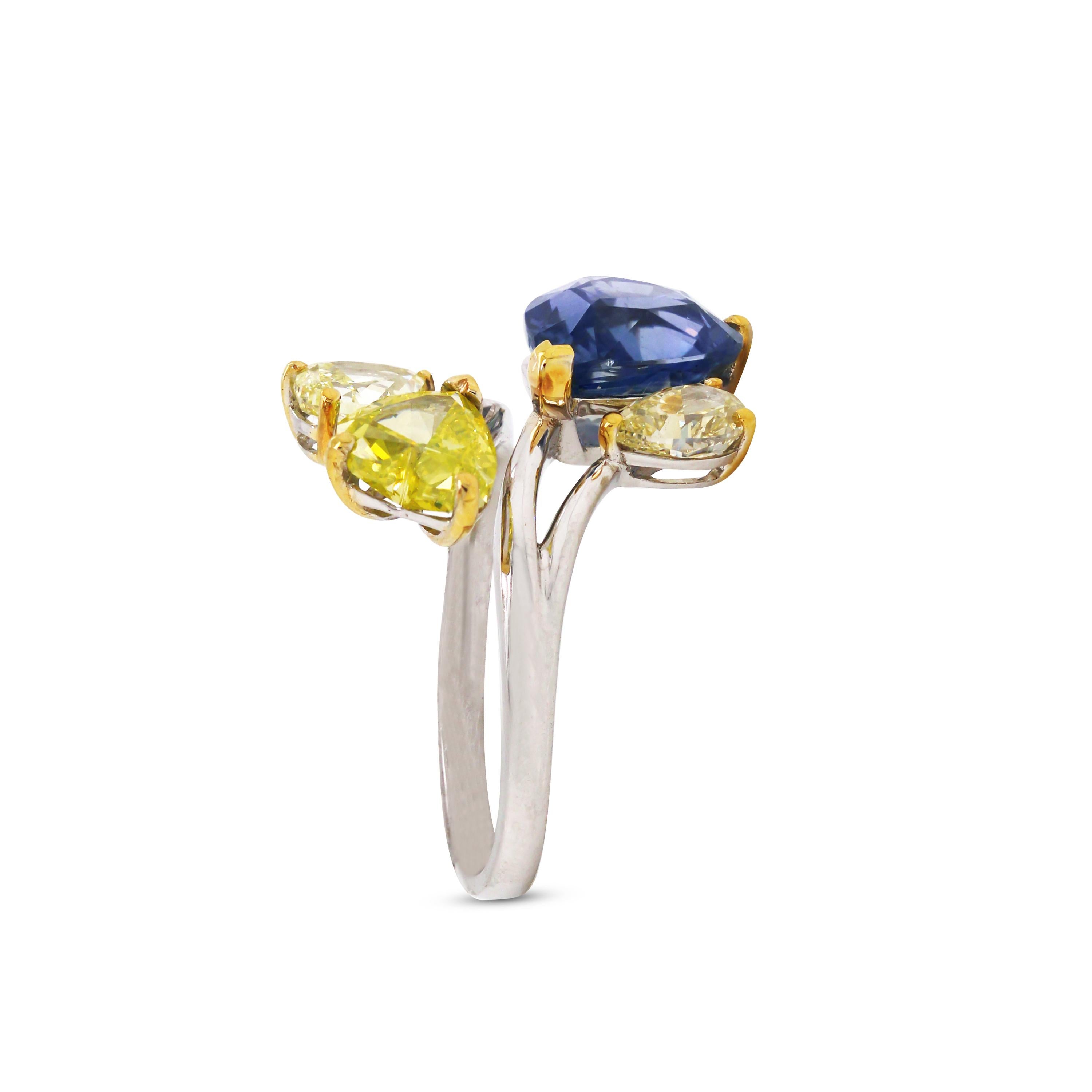 AGL 5.05 Carat Burma Blue Sapphire Fancy Yellow Diamond White Gold Cocktail Ring

This one-of-a-kind ring features a natural, no-heat Sapphire certified by AGL.

Burma Sapphire: 5.05 carat, Pear Shape, No Heat, No Clarity Enhancement. None heated
