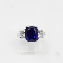 AGL 6.46 Carat Ceylon "Heat" Cornflower Blue Sapphire Three-Stone Diamond Ring