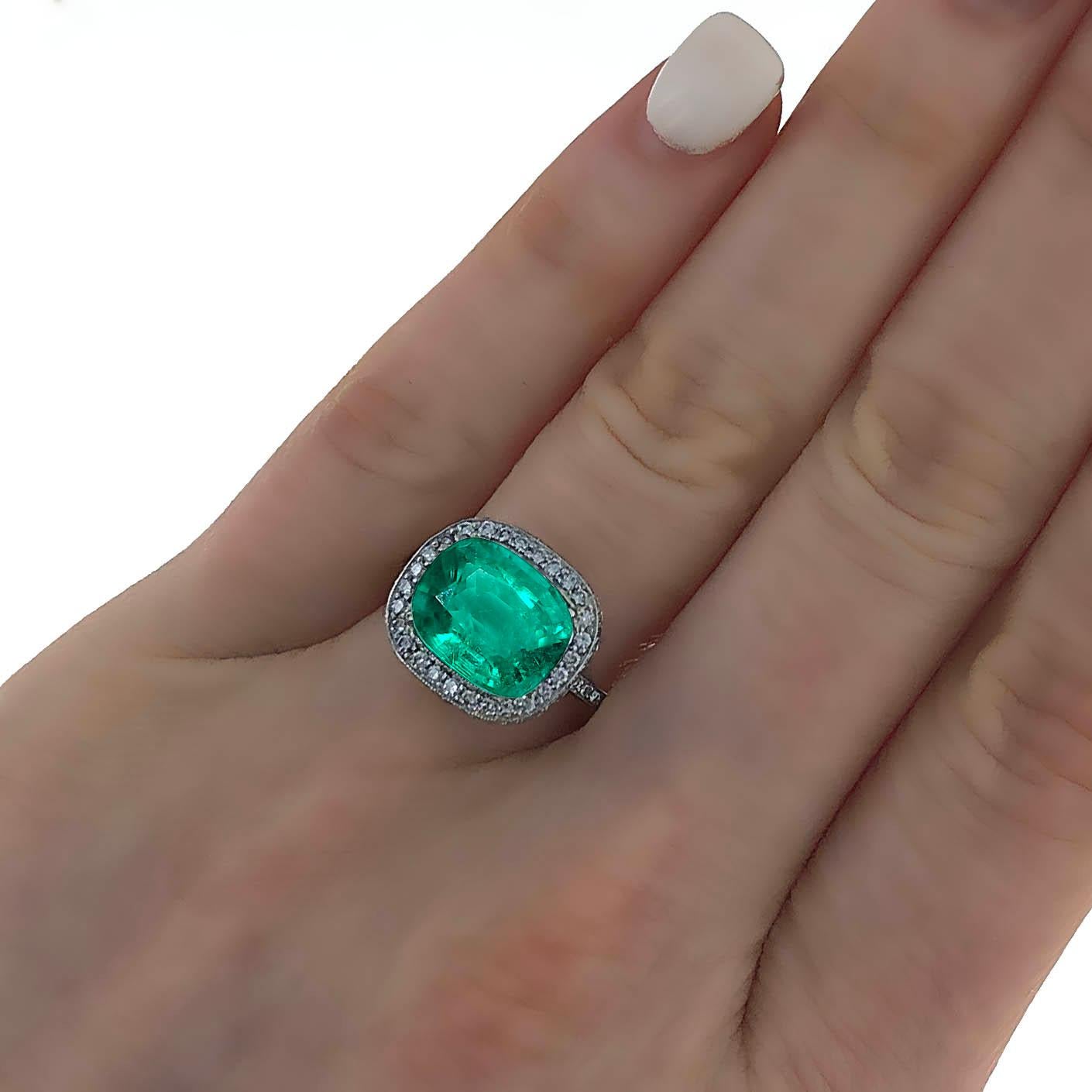 AGL and GUILD Certified 3.75 carat natural emerald and diamond cocktail  ring. The center stone is certified by the American Gemological Laboratories, AGL, and GUILD Laboratory. The certificates state that the stone is a natural Emerald. It is a
