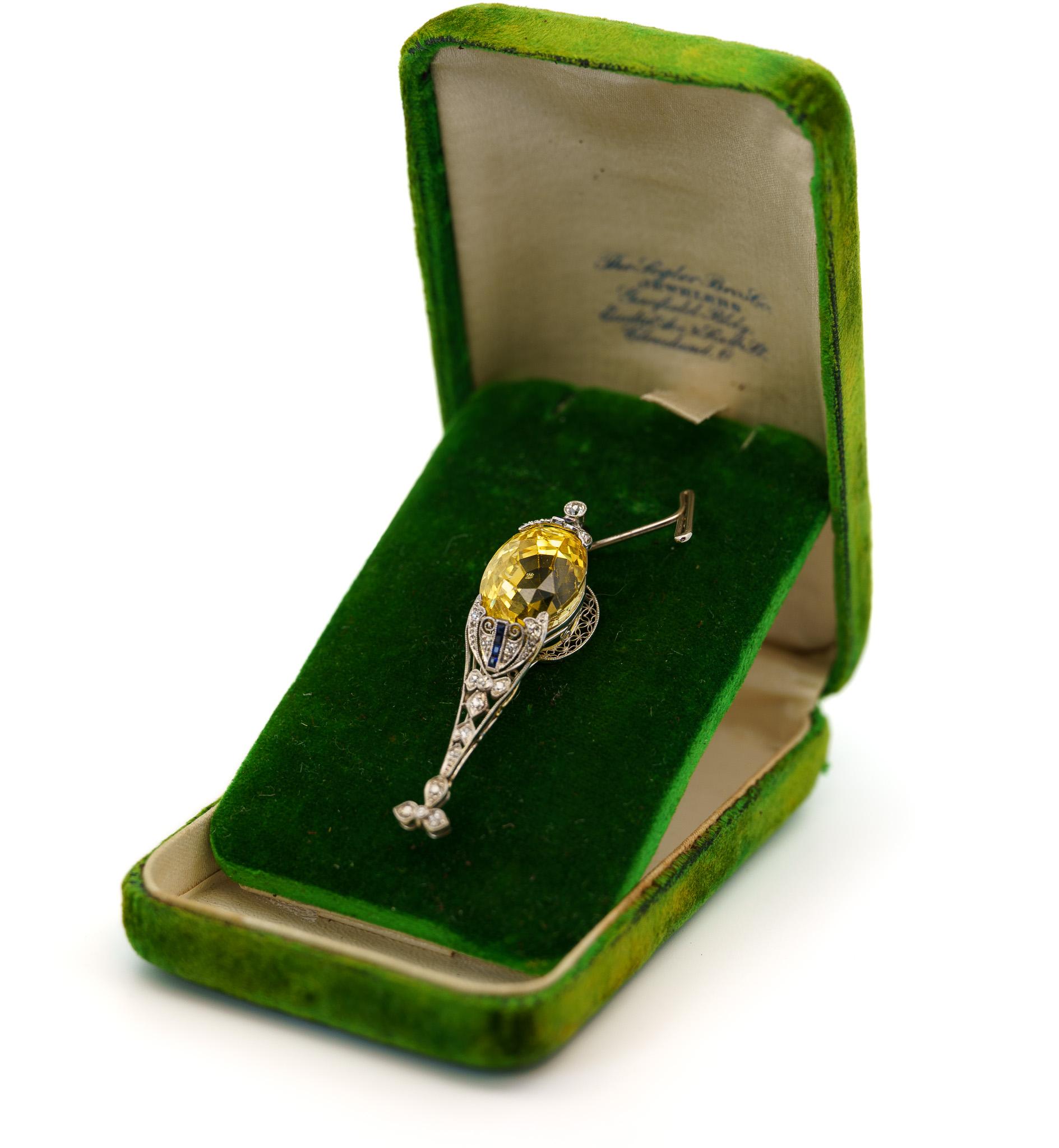 Antique Art Deco Era Platinum, Yellow Sapphire, and Diamond Pendant. 

This antique art deco pendant features a, non-heated Ceylon yellow sapphire. Non-heated yellow sapphires are scarce. There has been no modification to the color or appearance of