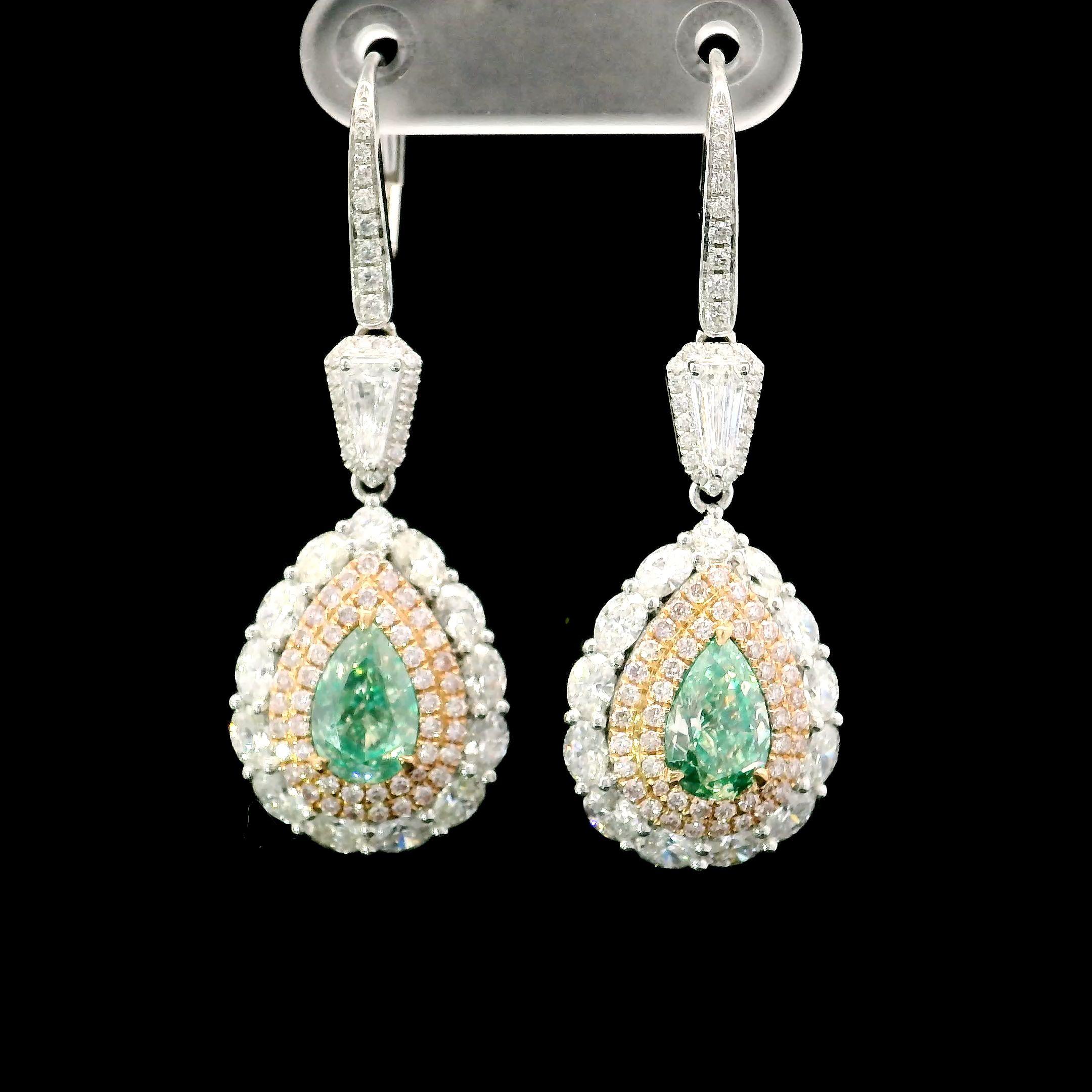 18kt white gold earring with diamonds
  
  Gold colour & karat: White gold 18kt
  Weight: 8.328 grams
  
  Set with-
  Stone type: Diamonds
  Shape: Pear
  Carat: 2.00
  Colour: Fancy Green
  Clarity: VS / SI

  Surrounding Stones: Diamonds
 1)