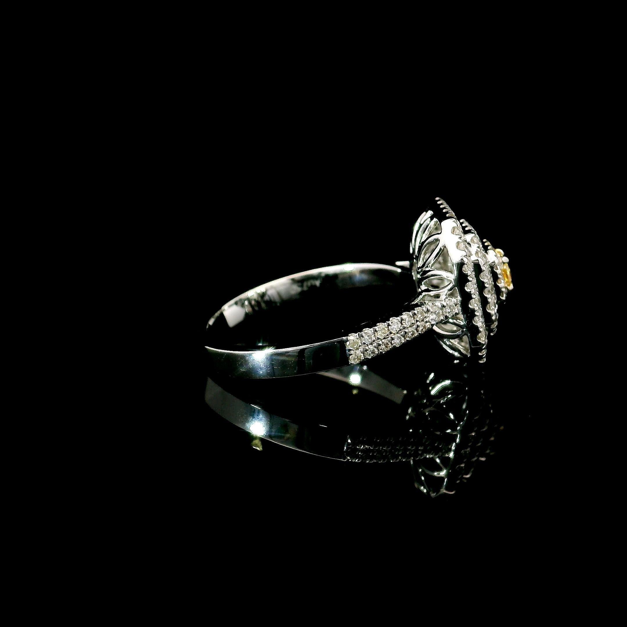  18kt white gold ring with diamonds
  
  Gold colour & karat: White gold 18kt
  Weight: 3.87 grams
  
  Set with-
  Stone type: Diamonds
  Shape: Cushion
  Carat: 0.091 ct
  Colour: Fancy Brownish Yellow
  Clarity: VS
  
  Surrounding Stones: