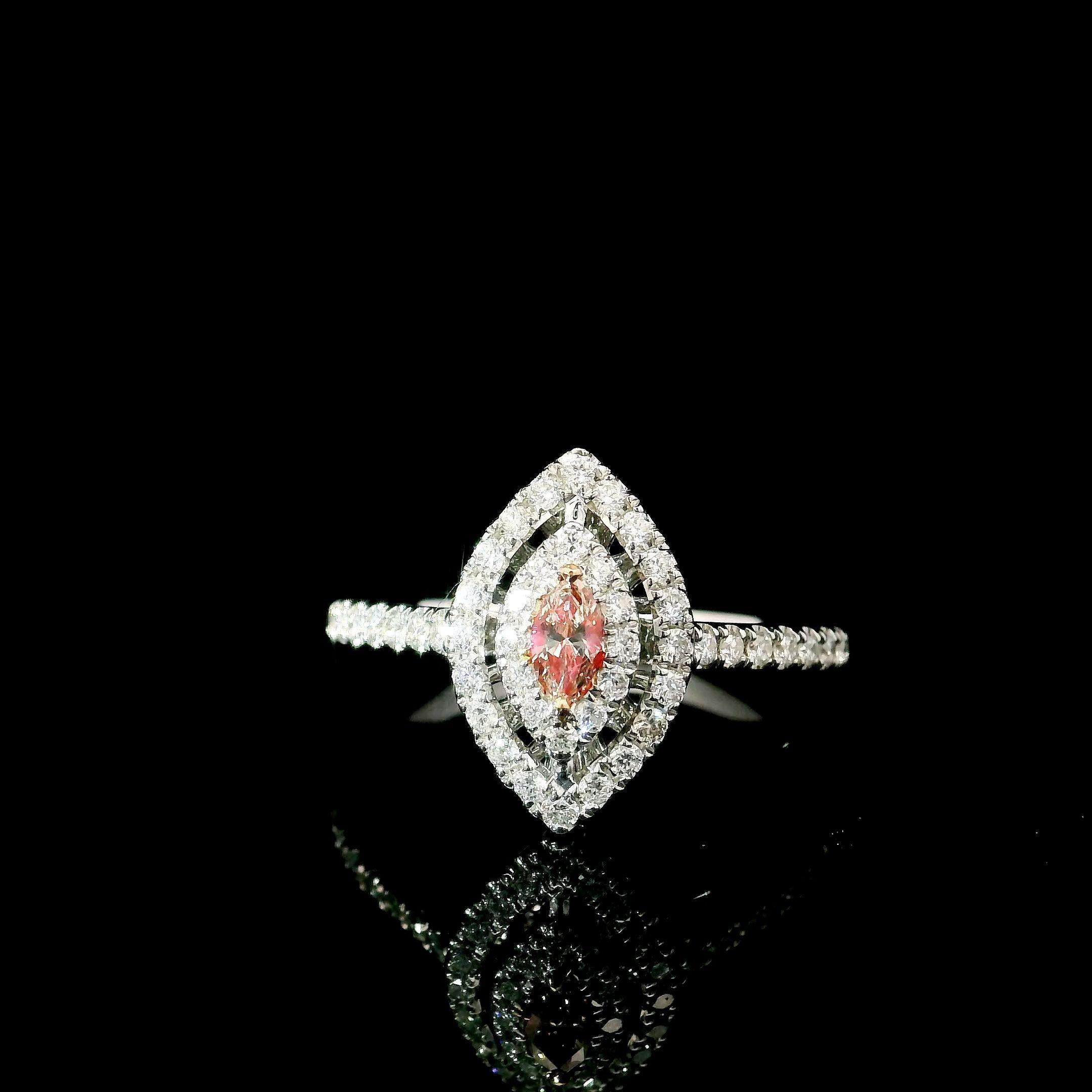 18kt white gold ring with diamonds
  
Gold colour & karat: White gold 18kt
Weight: 2.96 grams
  
Set with-
  Stone type: Diamonds
  Shape: Marquise
  Carat: 0.101 ct
  Colour: Fancy Pink
  Clarity: VS
  
  Surrounding Stones: Diamonds
 1) White