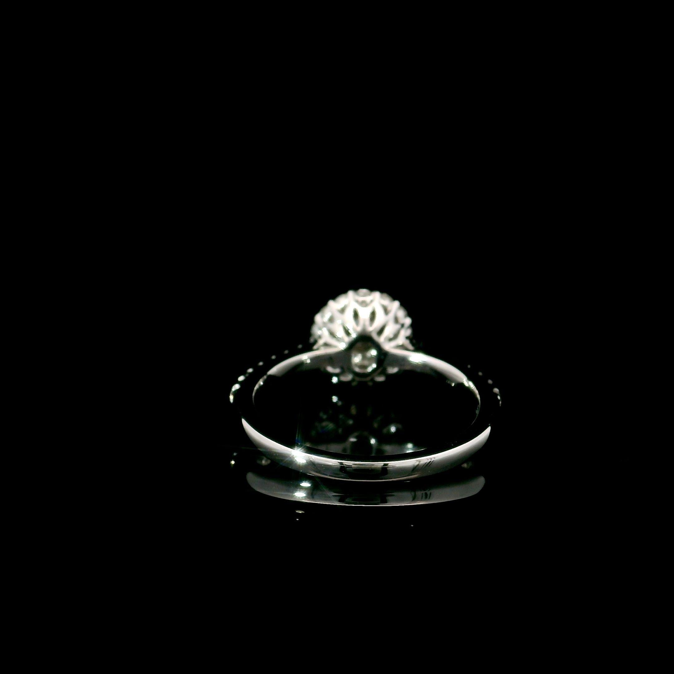 18kt white gold ring with diamonds
  
  Gold colour & karat: White gold 18kt
  Weight: 2.59 grams
  
  Set with-
  Stone type: Diamonds
  Shape: Oval
  Carat: 0.11 ct
  Colour: Fancy Yellow
  Clarity: VS
  
  Surrounding Stones: Diamonds
 1) White