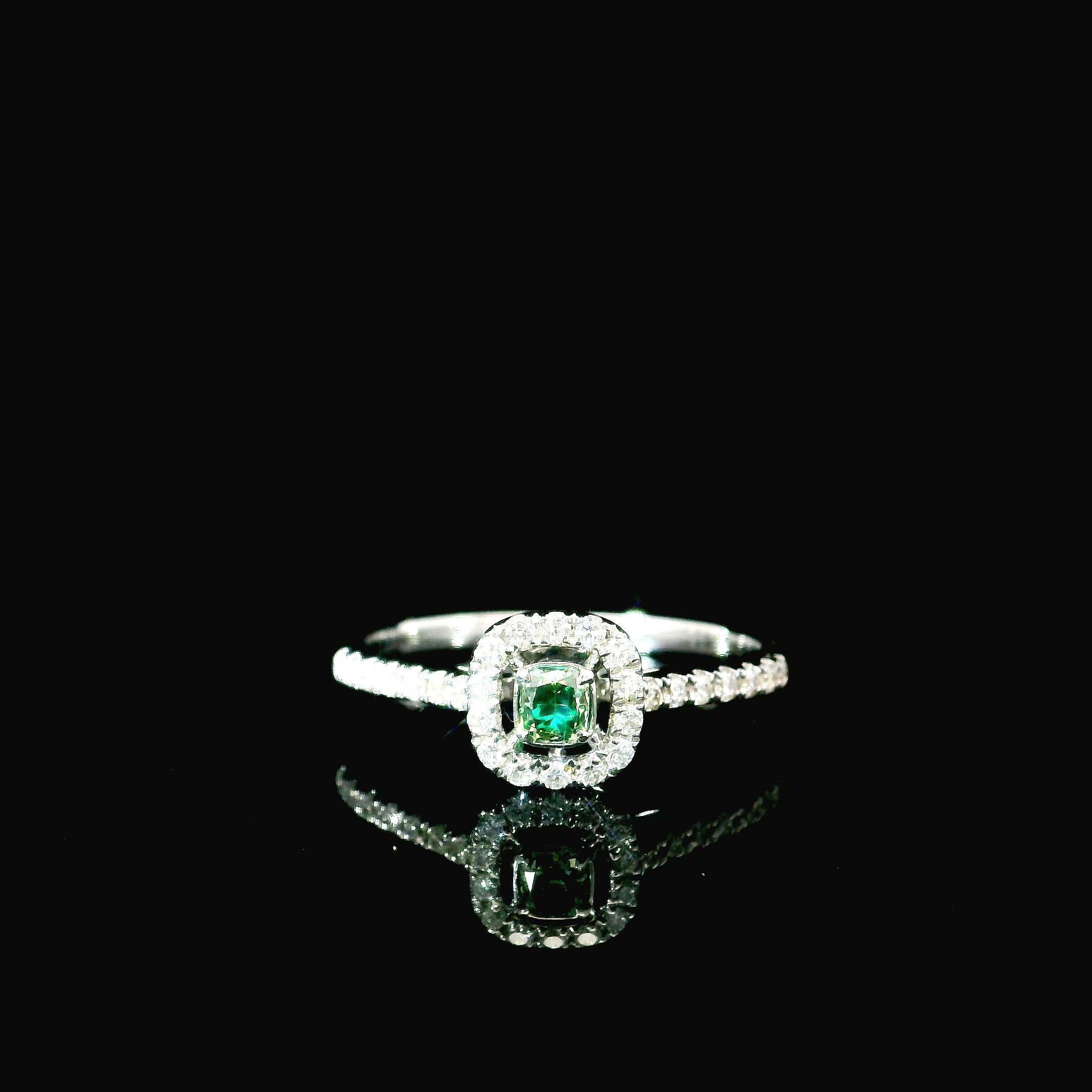 18kt white gold ring with diamonds
  
  Gold colour & karat: White gold 18kt
  Weight: 1.97 grams
  
  Set with-
  Stone type: Diamonds
  Shape: Cushion
  Carat: 0.112 ct
  Colour: Fancy Intense Green
  Clarity: VS
  
  Surrounding Stones: Diamonds
