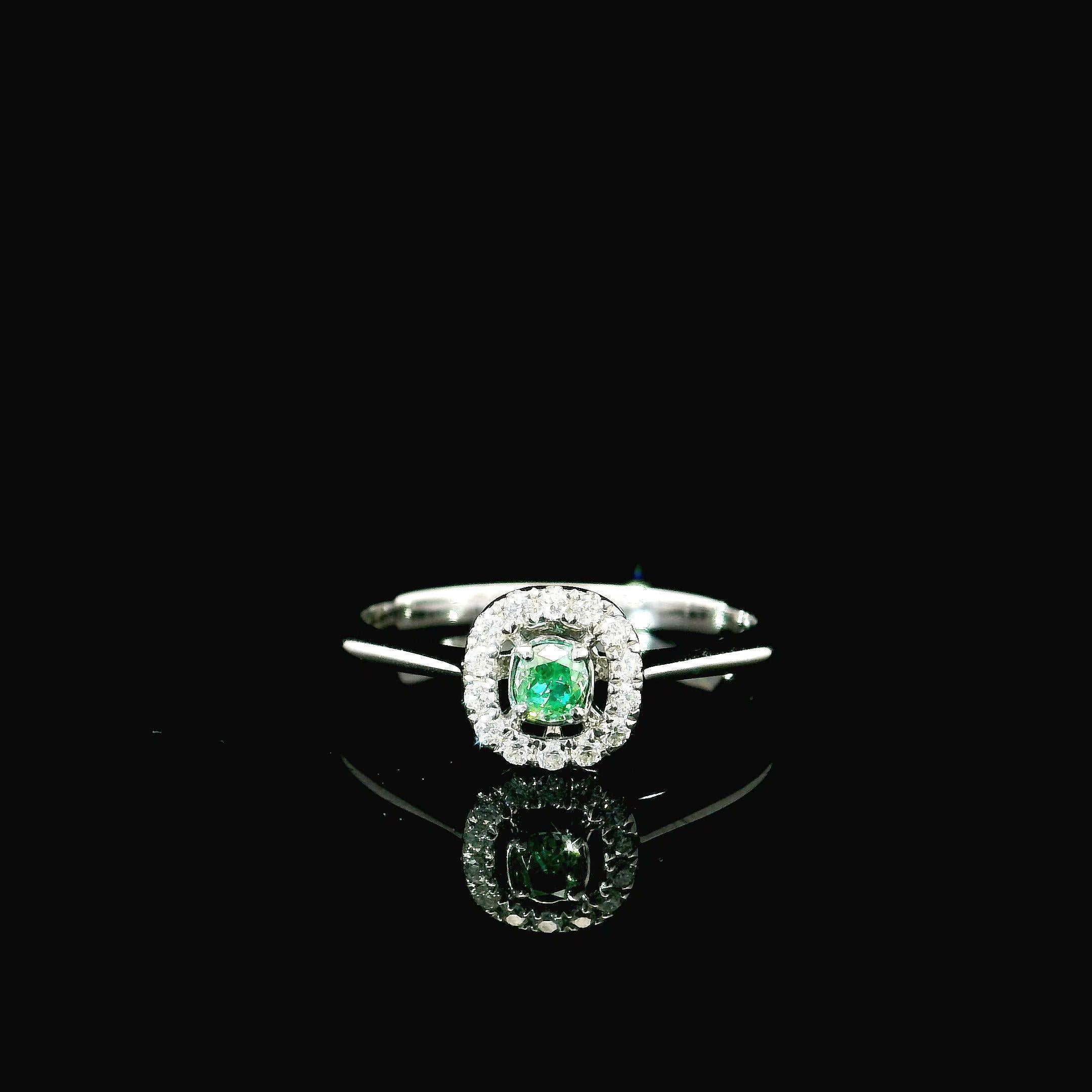 18kt white gold ring with diamonds
  
  Gold colour & karat: White gold 18kt
  Weight: 1.98 grams
  
  Set with-
  Stone type: Diamonds
  Shape: Cushion
  Carat: 0.113 ct
  Colour: Fancy Intense Green
  Clarity: VS
  
  Surrounding Stones: Diamonds
